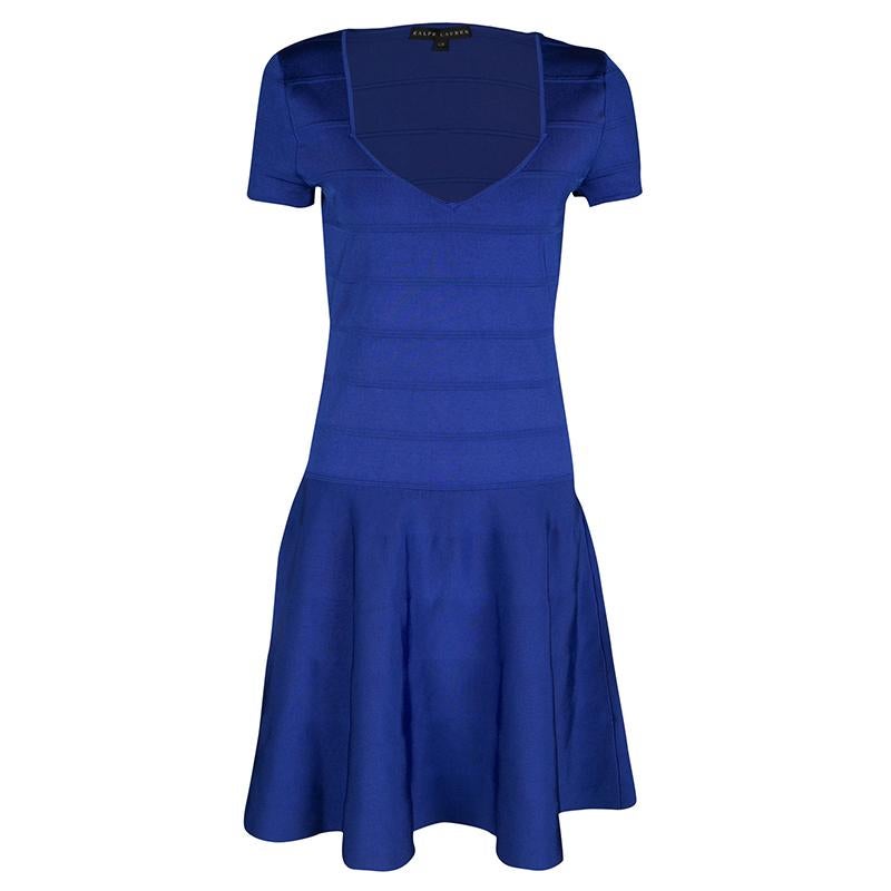 Ralph Lauren's Bandage dress is the epitome of wearable feminity. Designed in a true skater style, this blue outfit has a fitted, paneled bodice with fluid bottom featuring loose pleats. It has short structured sleeves and an impressive v-neckline.