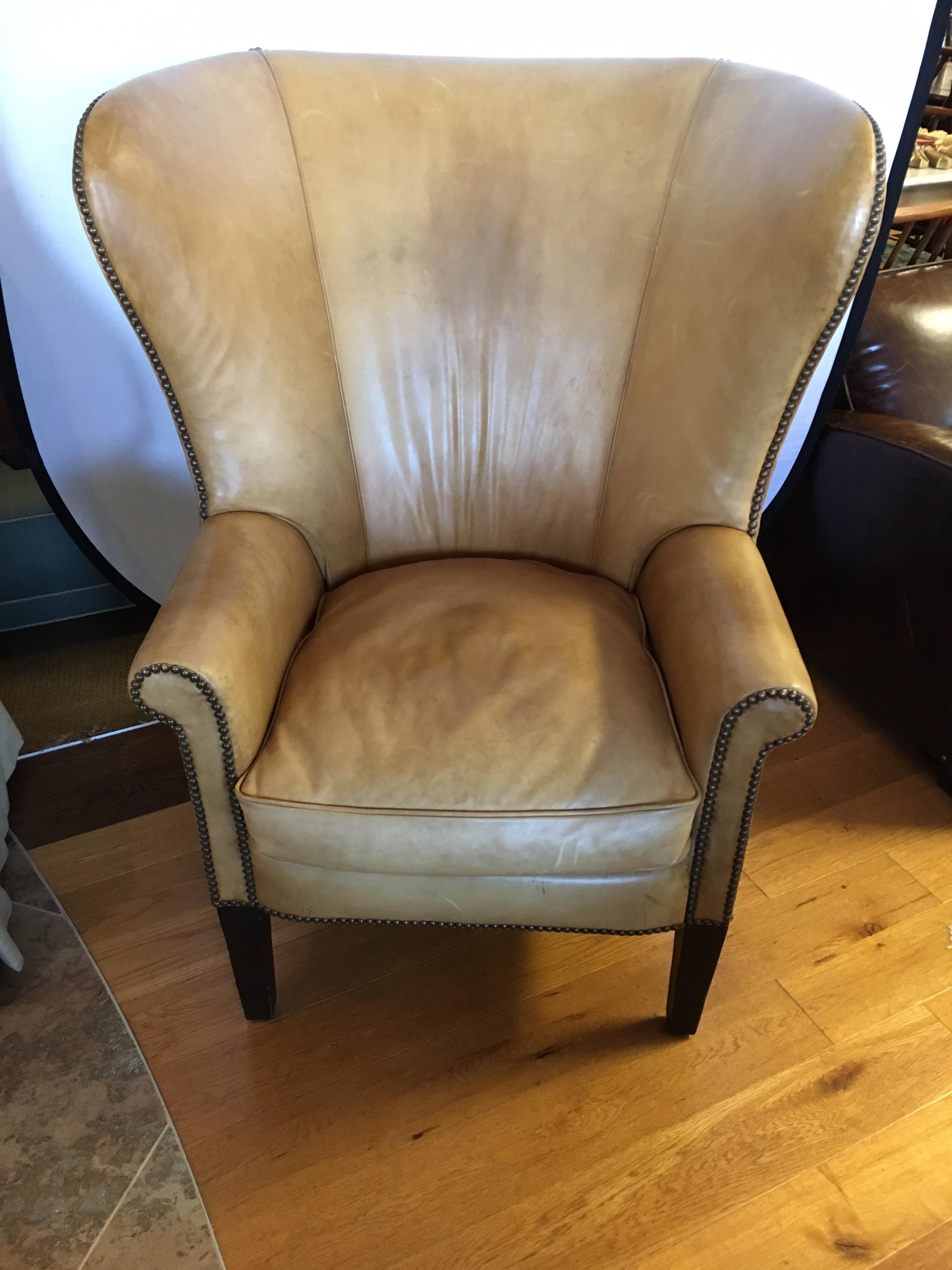 Stunning vintage Ralph Lauren large leather and nailhead wingback chair with a most unusual, and sought after back (see pictures attached). Leather is broken in perfectly and color is a dark beige.