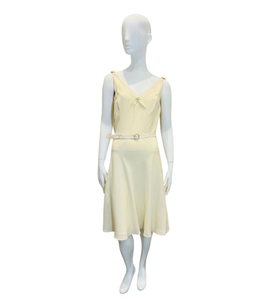 Ralph Lauren Silk Dress With Mother-Of-Pearl Details
Ivory sleeveless dress designed with Mother-Of-Pearl ring details.
Featuring V-Neckline, belted waist and flared, knee-length skirt.
Size – 6UK
Condition – Very Good
Composition – 100% Silk,