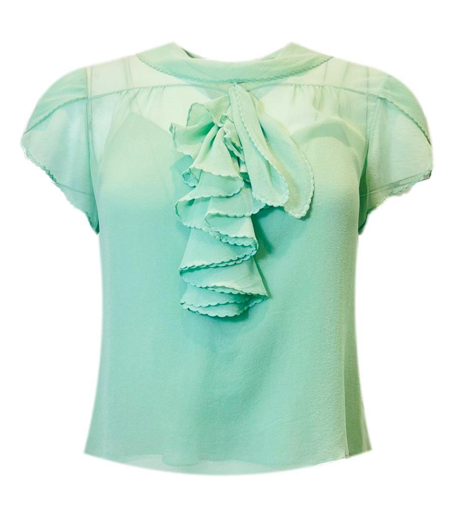 Ralph Lauren Silk Top

Mint, short sleeved blouse designed with ruffle detailing to the front.

Styled with rolled, round neckline and relaxed fit with sheer finish.

Size – S (Label missing but corresponds)

Condition – Very Good

Composition –