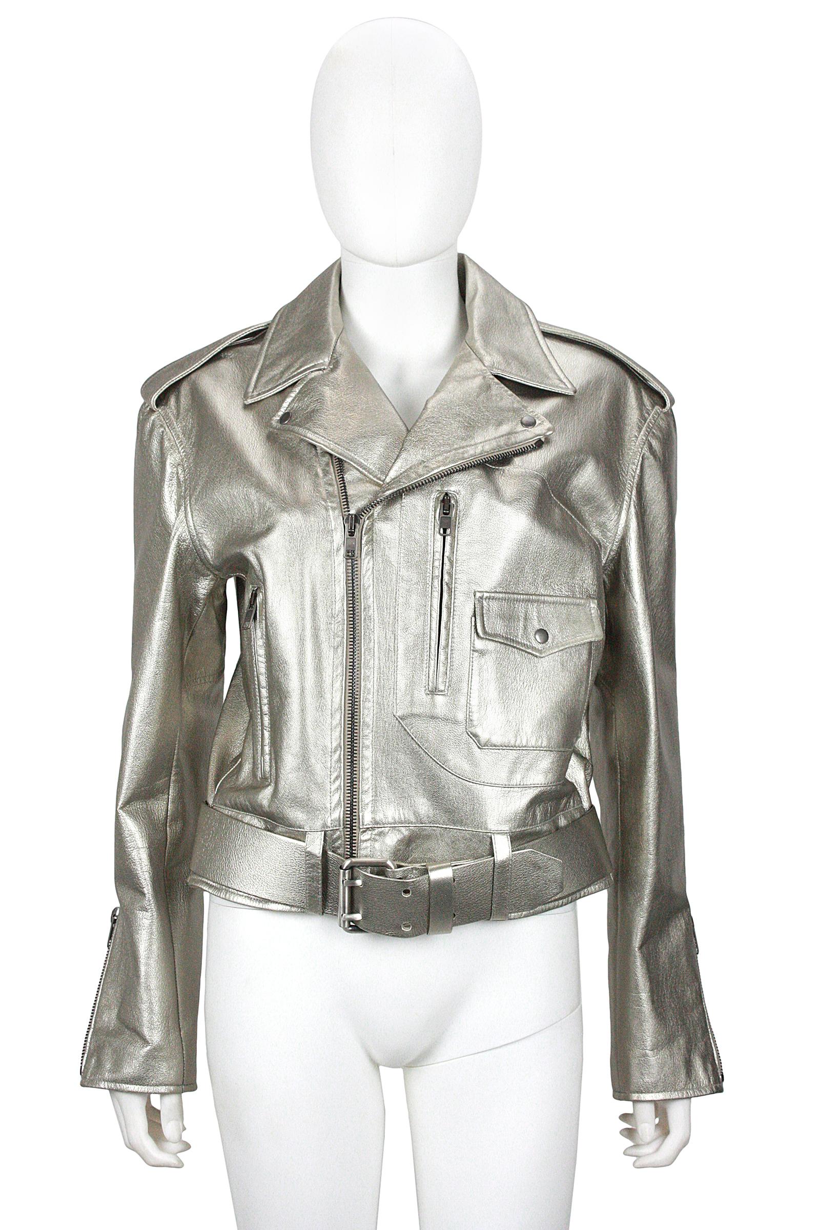 Ralph Lauren Collection
Belted moto jacket
Silver metallic coated goatskin leather 
Silver metallic coated leather belt 
Off-Center bronze zipper closure 
Two zippered pockets
One snap pocket 
Sleeve side zippers 
Lapel collar with snaps
Silver silk