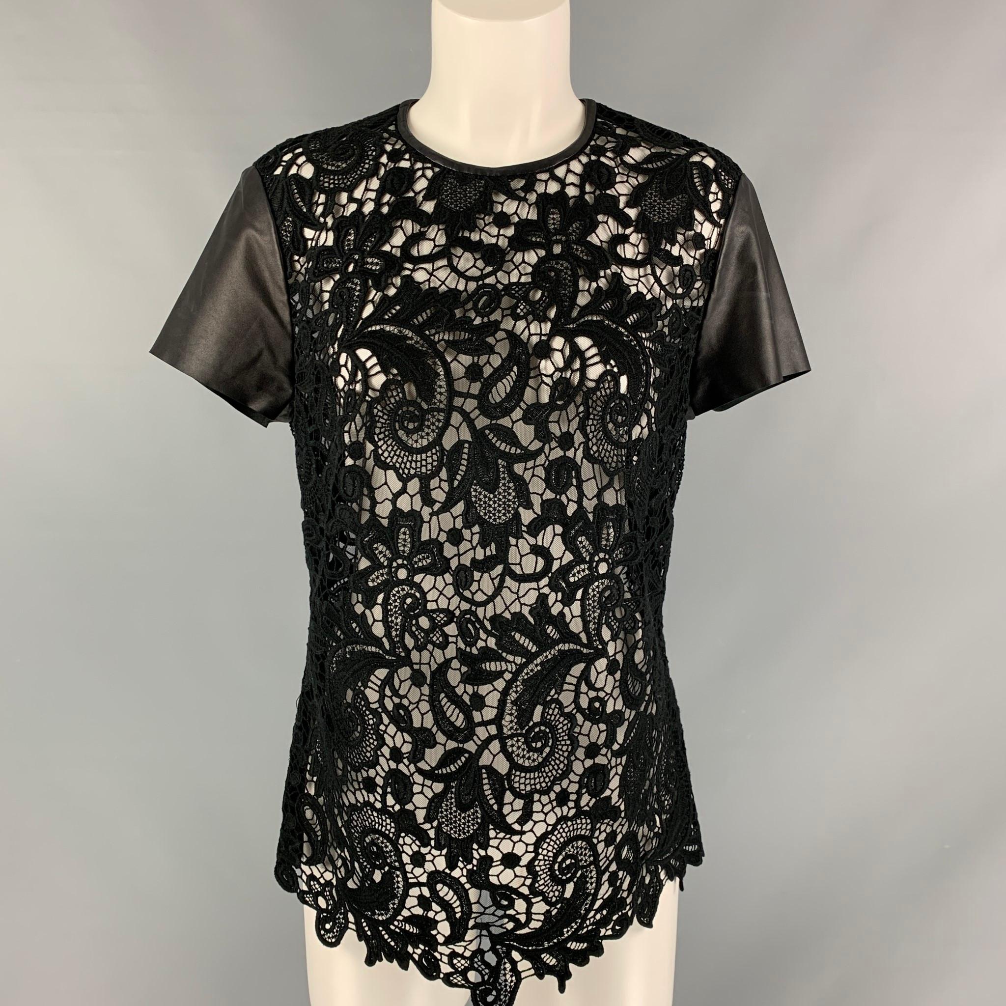 RALPH LAUREN BLACK LABEL short sleeves shirt comes in black guipure lace fabric featuring leather details. Made in USA.

Excellent Pre-Owned Condition.
Marked: 10

Measurements:

Shoulder: 16 in.
Bust: 40 in.
Sleeve: 6.5 in.
Length: 27 in.   

