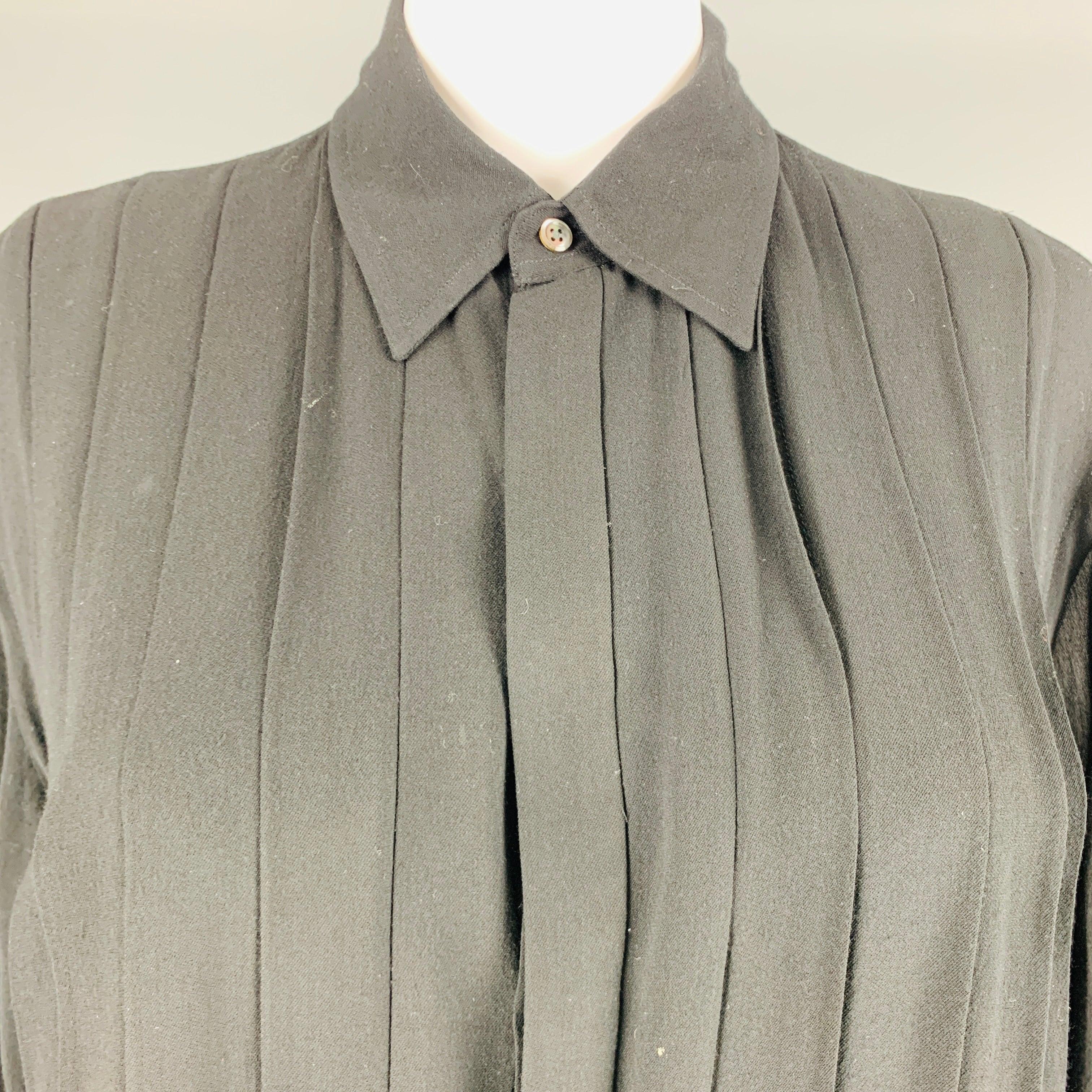 RALPH LAUREN long sleeves blouse comes in black viscose woven features a plated panel at front, hidden placket, straight collar, and button down closure. Excellent Pre- Owned Condition. 

Marked:   10 

Measurements: 
 
Shoulder: 18.5 inches Bust: