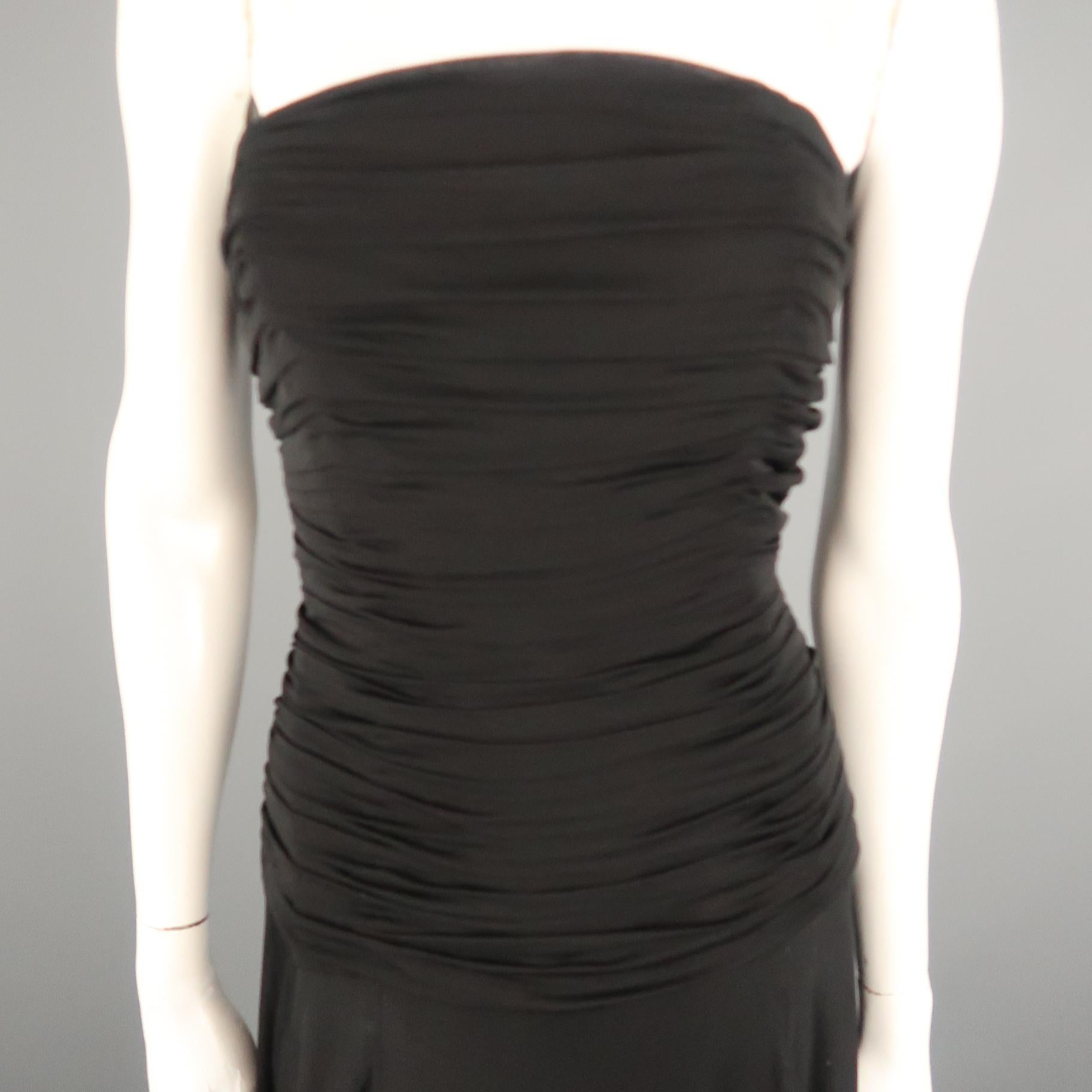 RALPH LAUREN COLLECTION gown comes in black viscose with a ruched drape detailed bustier top and full layered skirt. Minor wear along hem. As-is.
 
Very Good Pre-Owned Condition.
Marked: 10
 
Measurements:
 
Bust: 36 in.
Waist: 28 in.
Hip: 38