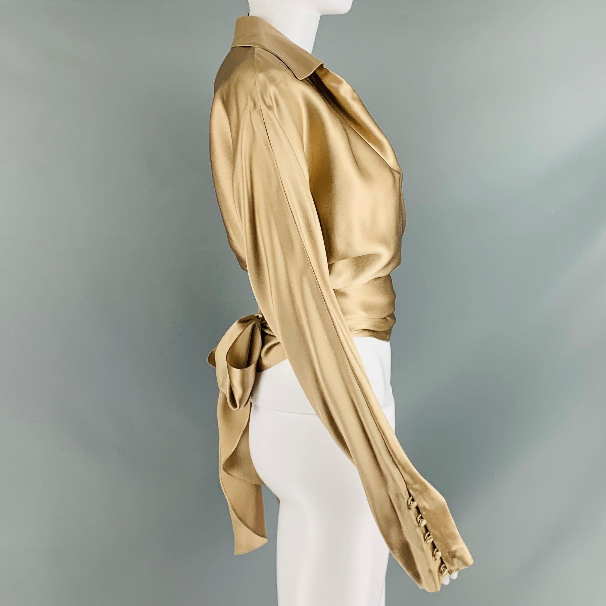 RALPH LAUREN BLACK LABEL long sleeves blouse comes in champagne silk woven features a wrap up design, and a straight collar.Excellent Pre- Owned Condition. 

Marked:   10 

Measurements: 
 
Shoulder: 15.25 inches Bust: 34 inches Sleeve: 25 inches
