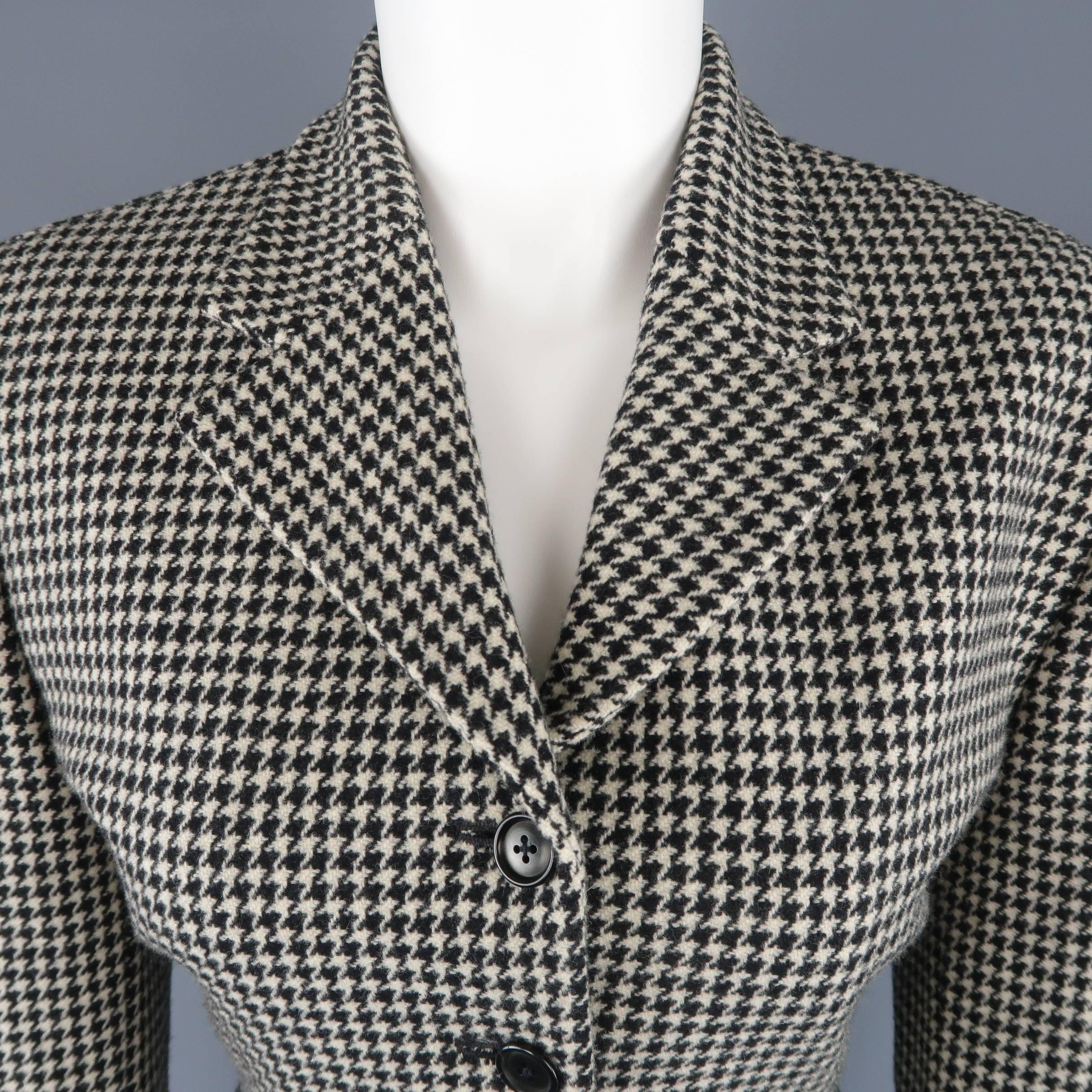 RALPH LAUREN COLLECTION jacket comes in cream and black houndstooth wool cashmere blend fabric with a notch lapel, padded shoulder, four button front, and cropped silhouette. Mad in USA.
 
Excellent Pre-Owned Condition.
Marked: 10
 
Measurements:
