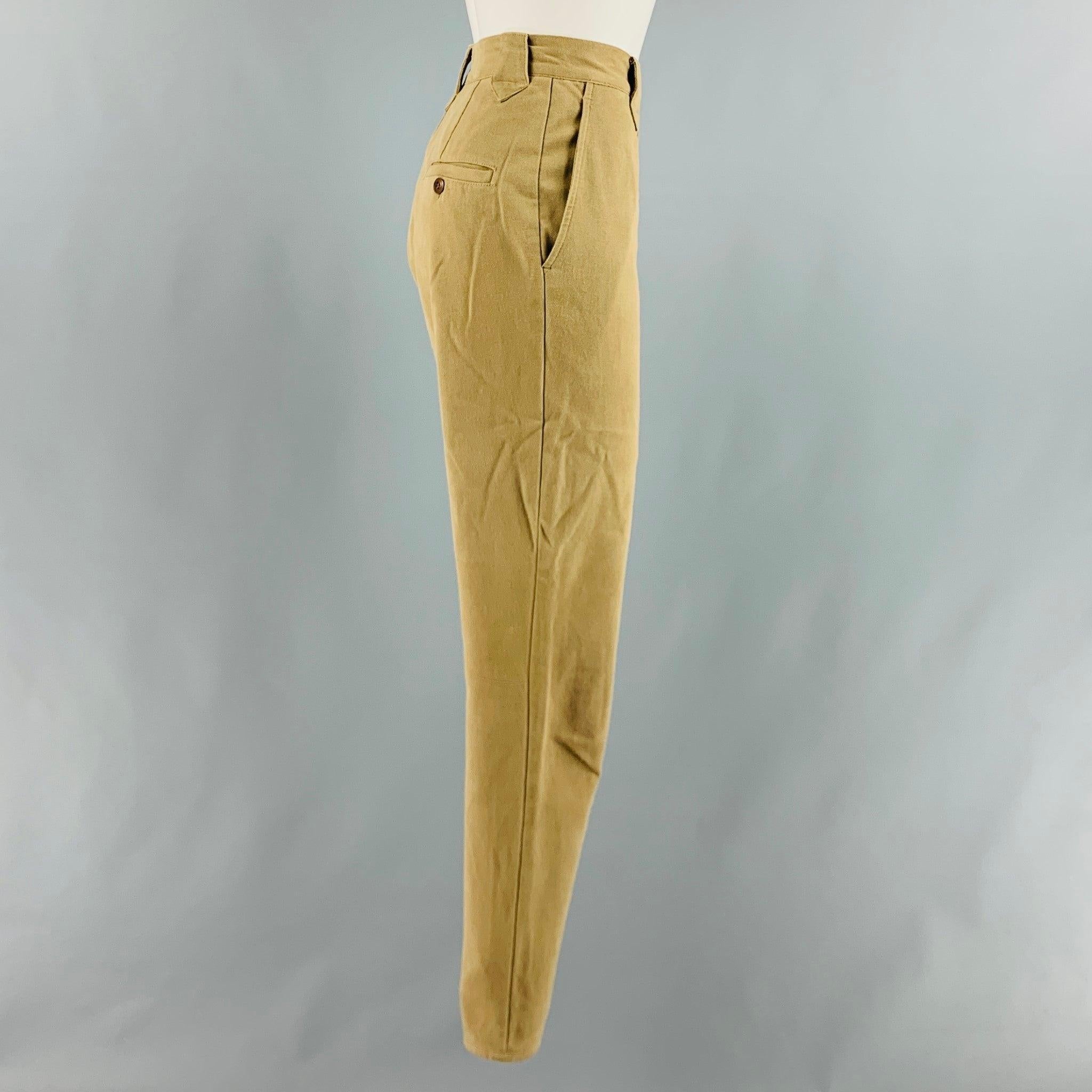 RALPH LAUREN COUNTRY casual pants comes in a khaki and brown cotton and lycra twill featuring brown suede patch details, slim fit, high waist, zipper cuffs, and a zip fly closure. Made in USA.Excellent Pre-Owned Condition. 

Marked:   10
