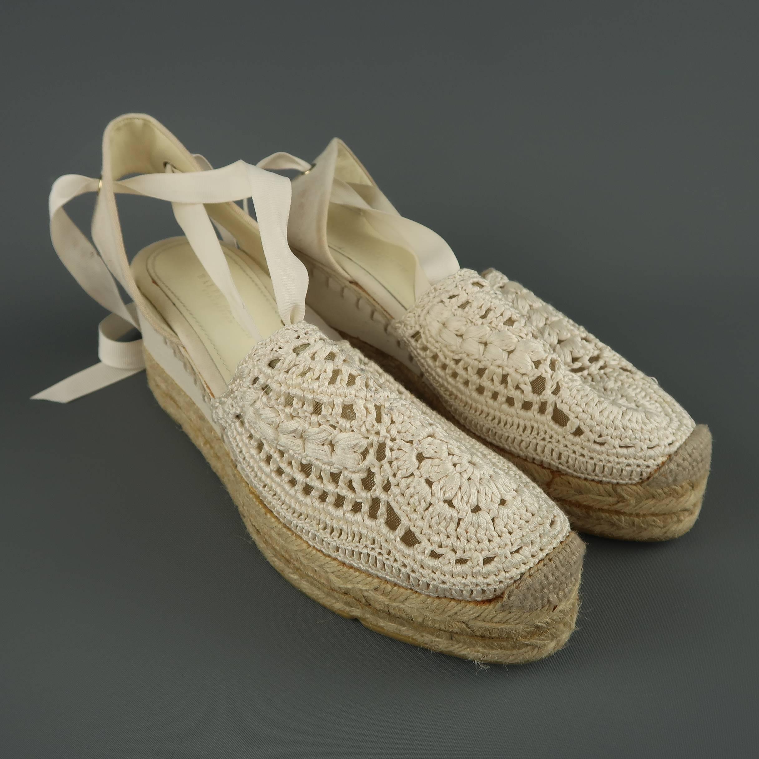 RALPH LAUREN COLLECTION espadrilles feature a cream crochet front,  canvas slingback with ankle ties, and platform wedge sole. Discolorations throughout. As-is.
 
Fair Pre-Owned Condition.
Marked: 10
 
Heel: 2.5 in.
