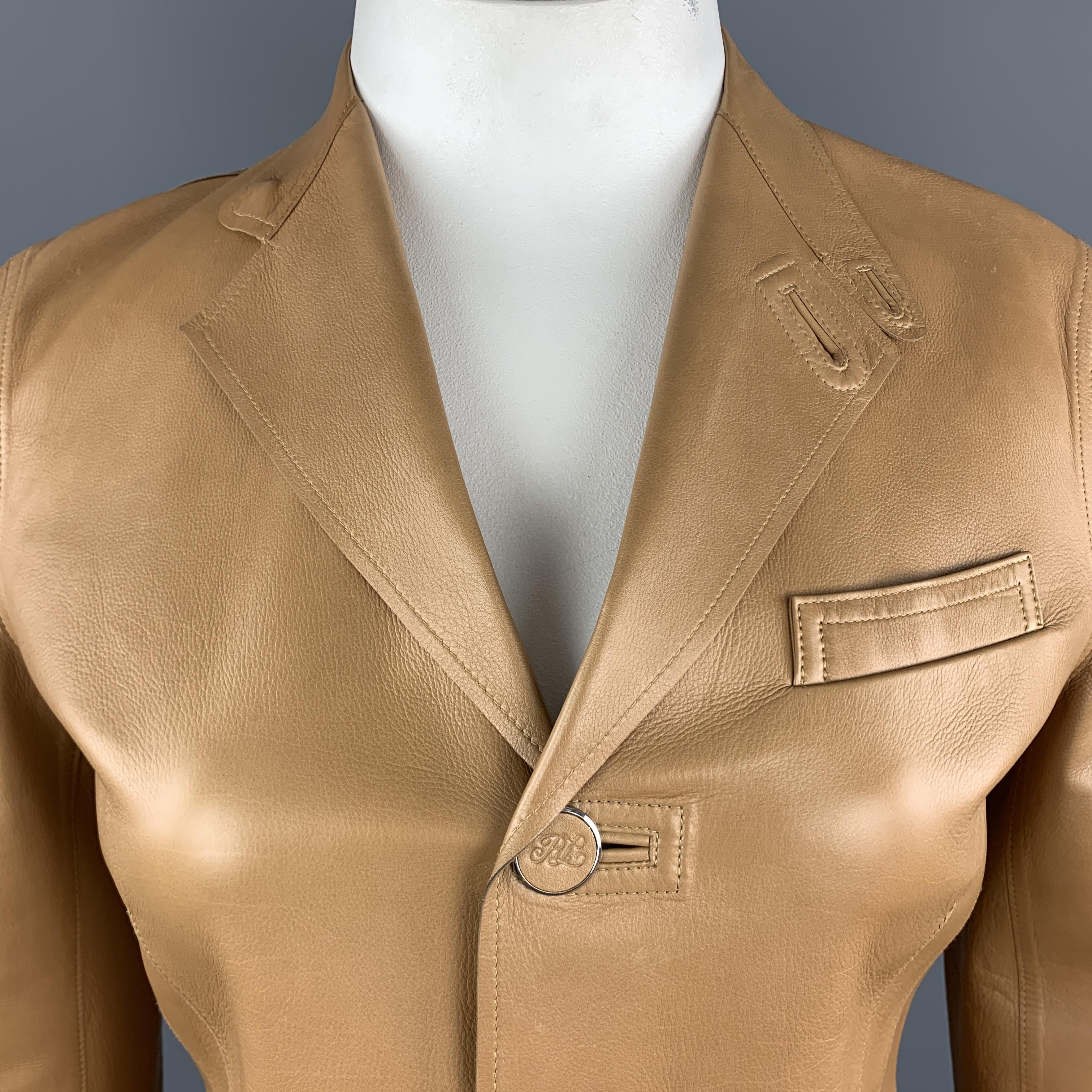 RALPH LAUREN Back Label blazer jacket comes in caramel tan leather with a three button single breasted front, notch tab lapel, slanted pockets, and embossed buttons. Wear and marks throughout. As-is. 

Fair Pre-Owned Condition.
Marked: