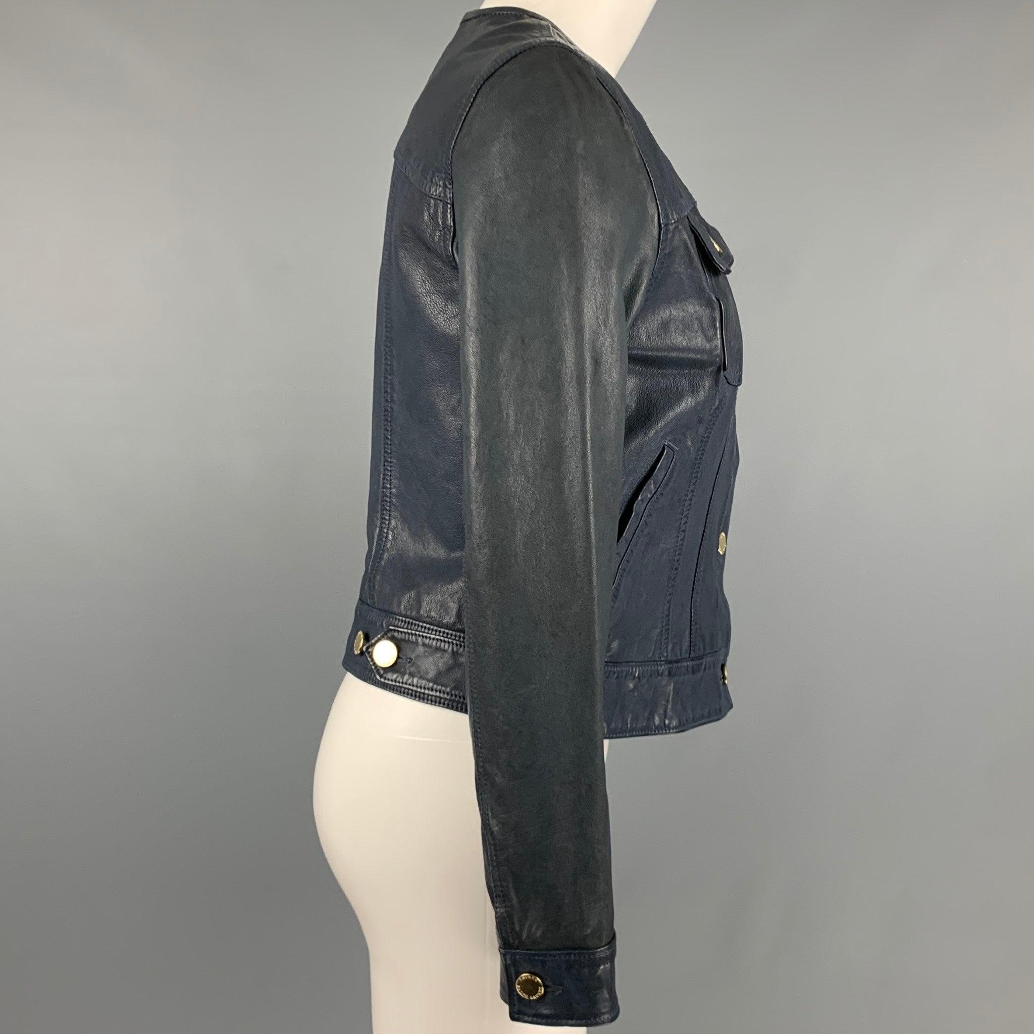 LAUREN by RALPH LAUREN jacket
in a navy leather fabric featuring a trucker style, gold tone buttons, and button closure. Excellent Pre-Owned Condition. 

Marked:   2 

Measurements: 
 
Shoulder: 14.5 inches Bust: 32 inches Sleeve: 24 inches Length: