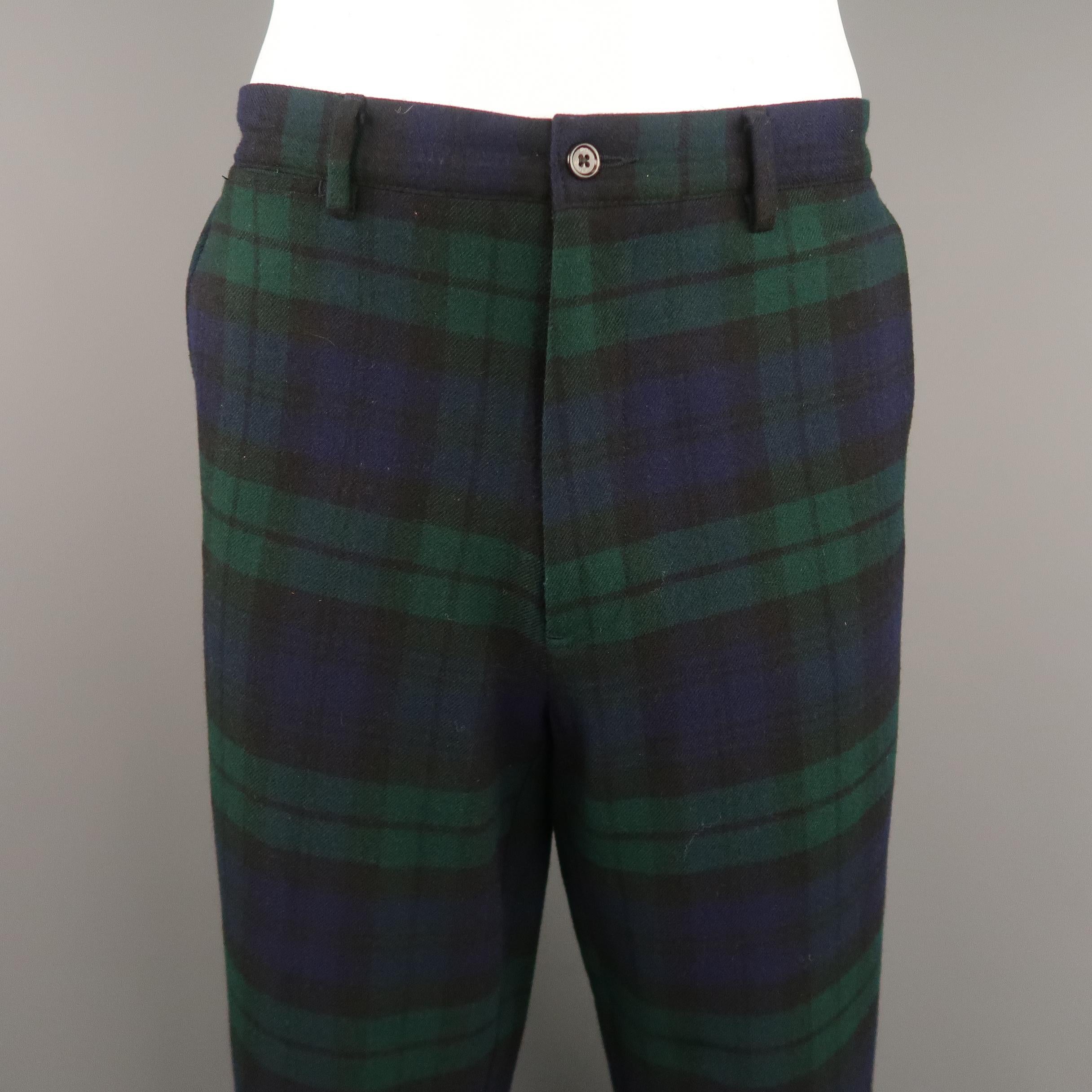 POLO RALPH LAUREN pants come in navy and green Blackwatch plaid wool with a zip fly and relaxed leg.
 
Excellent Pre-Owned Condition.
Marked: 36/32
 
Measurements:
 
Waist: 36 in.
Rise: 12 in.
Inseam:  32 in.