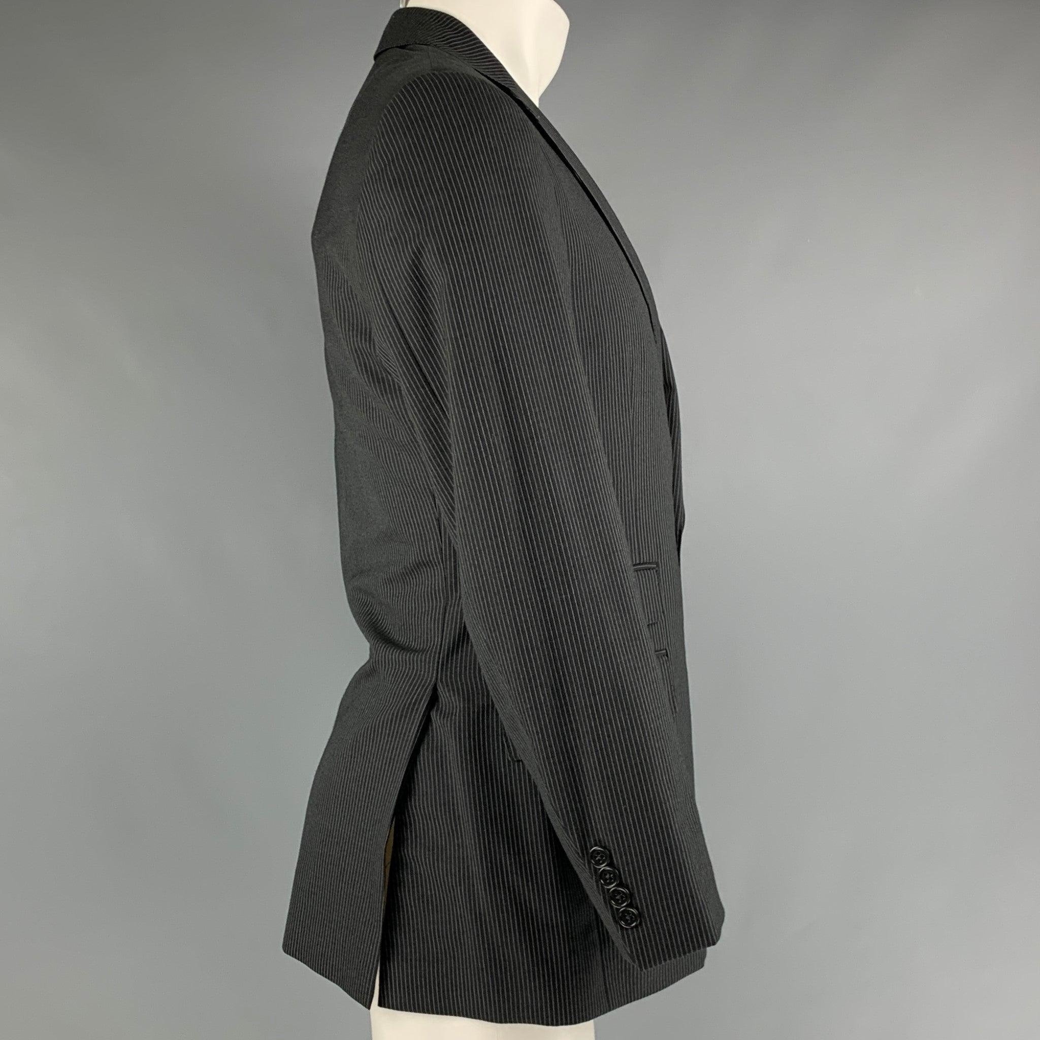 RALPH LAUREN PURPLE LABEL
sport coat in a black and grey pinstripe wool featuring a notch lapel, flap pockets, double back vent, and a double button closure. Handmade in Italy. Very Good Pre-Owned Condition. 

Marked:   38 R 

Measurements: 
