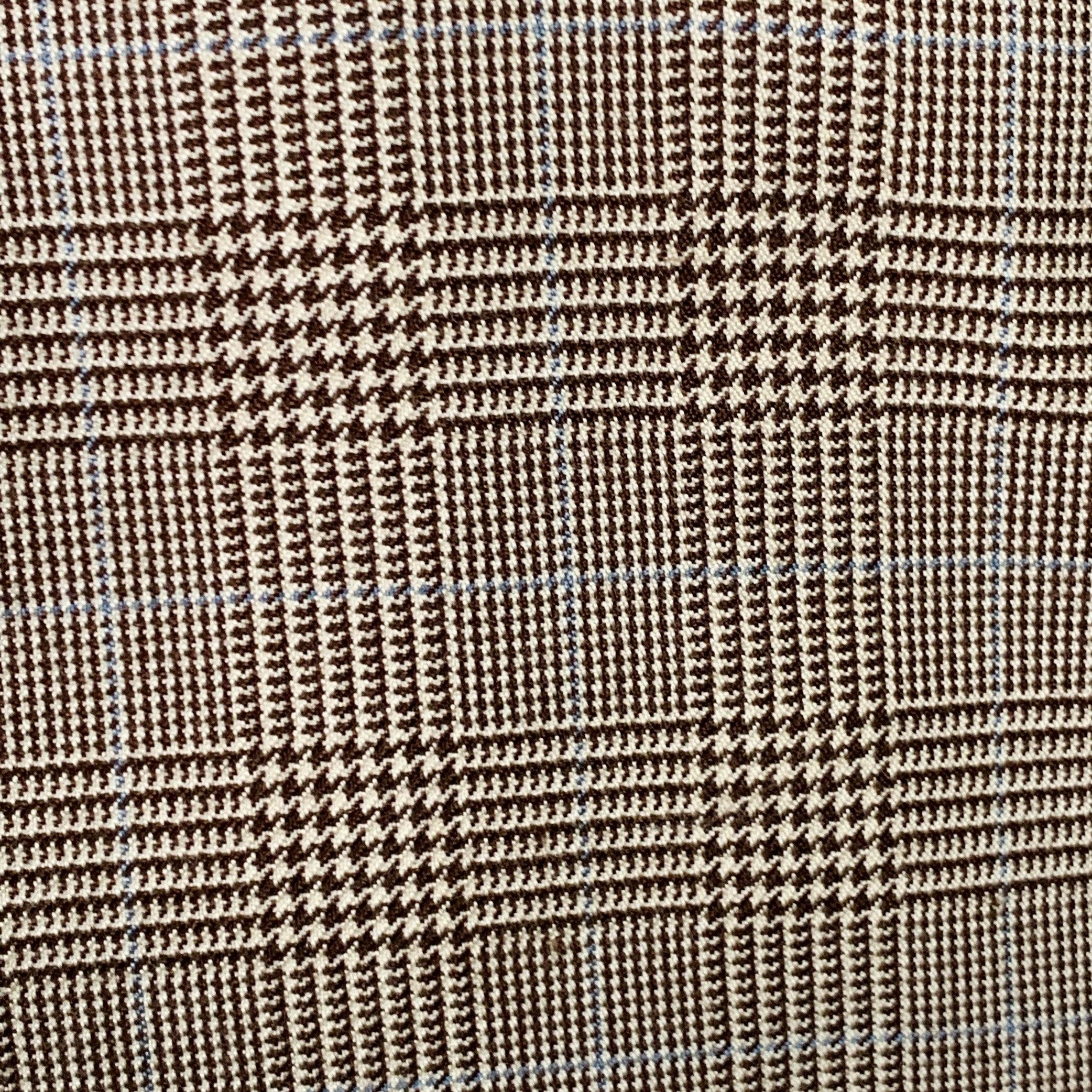 RALPH LAUREN PURPLE LABEL sport coat in a brown and beige cashmere silk blend fabric featuring a plaid pattern, notch lapel, ventless back, and double button closure. Note: the sleeves on this garment have been professionally altered and are