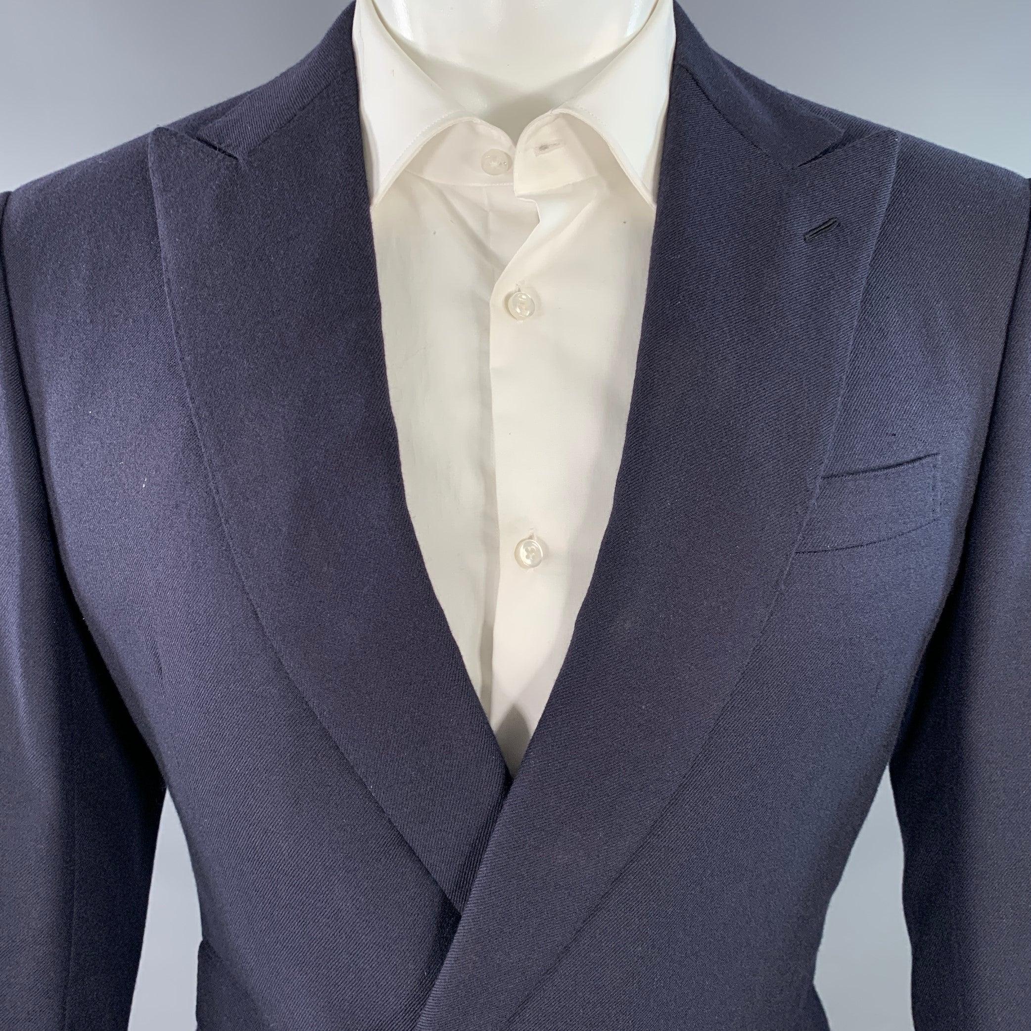 RALPH LAUREN PURPLE LABEL sport coat in a navy cashmere twill fabric featuring a double breasted style, peak lapel, double vented back, and double button closure with gold tone metal crest buttons. Note: the sleeves on this garment have been