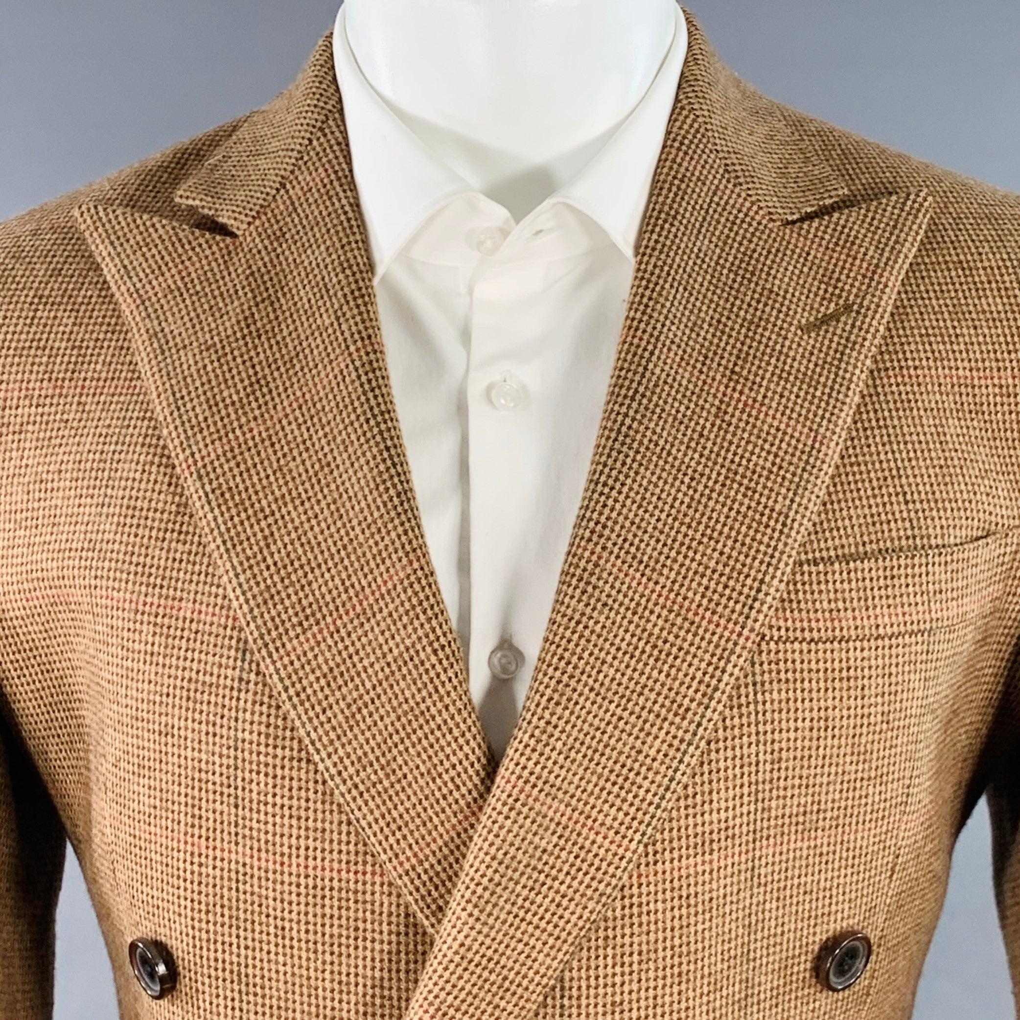 RALPH LAUREN PURPLE LABEL sport coat in a tan and brown cashmere fabric featuring a houndstooth pattern, double breasted style, peak lapel, double vented back, and double button closure. Note: the sleeves on this garment have been professionally