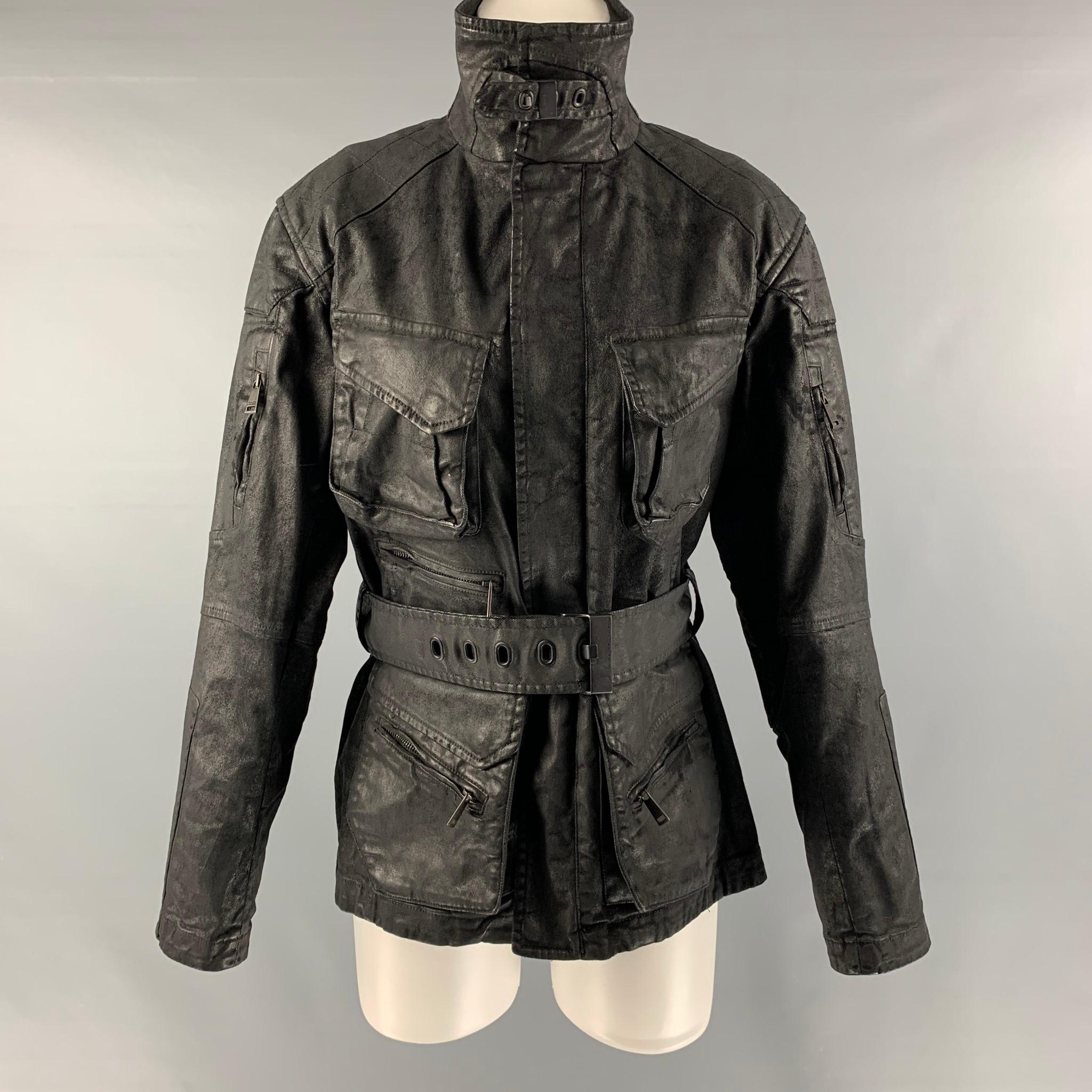 RALPH LAUREN 'BLACK LABEL by' motorcycle jacket comes in a black cotton and elastane coated canvas featuring a high neck, multiple pocket at front, black belt, and zip up closure. Made in Italy.

Excellent Pre-Owned Condition.
Marked: