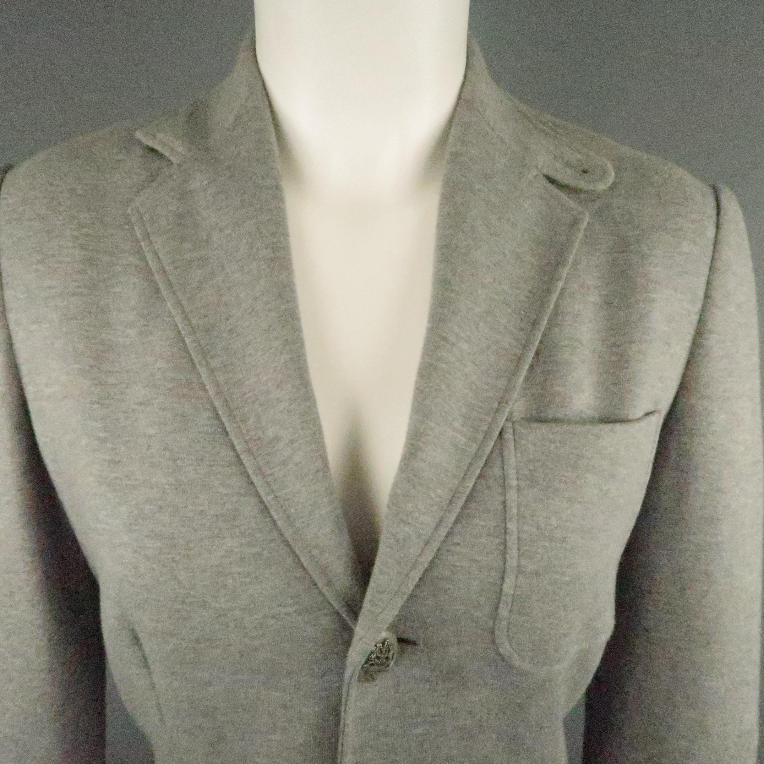 Black Label by RALPH LAUREN equestrian style blazer jacket comes in heather gray cotton blend jersey with a tab collar notch lapel, patch pockets, single breasted three button front with crest buttons, and functional button cuffs.
 
Excellent