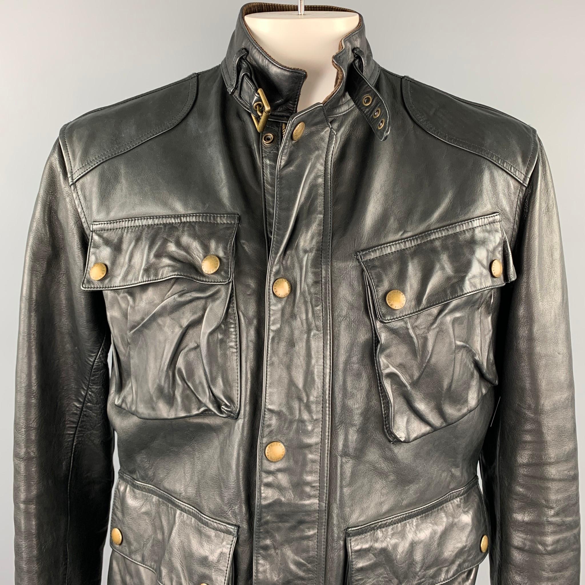 RALPH LAUREN jacket comes in a black leather with a corduroy collar featuring a belted strap collar, patch pockets, side strap details, and a zip and snap button closure. 

Good Pre-Owned Condition.
Marked: L

Measurements:

Shoulder: 20 in. 
Chest: