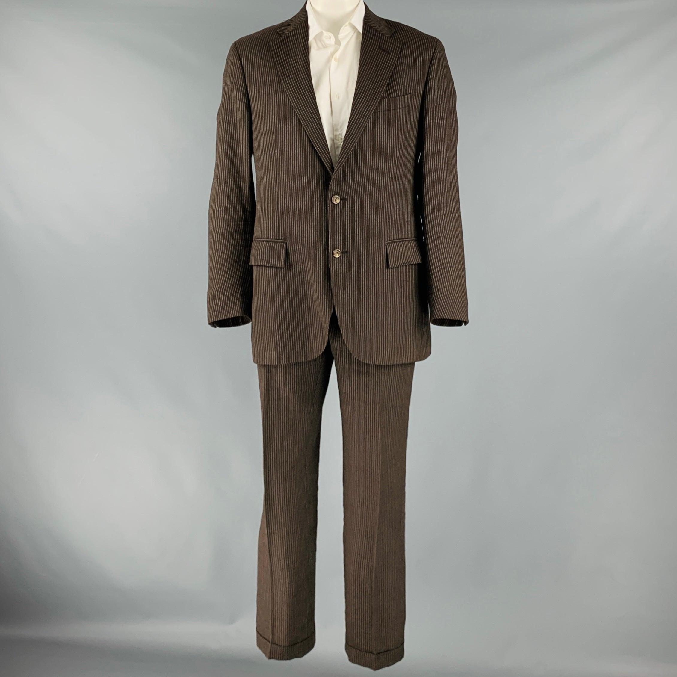 RALPH LAUREN suit
in a brown striped wool with a full liner and includes a single breasted, double button sport coat with notch lapel and matching flat front trousers. Made in Italy.Very Good Pre-Owned Condition. Mild pilling on legs. 

Marked:  