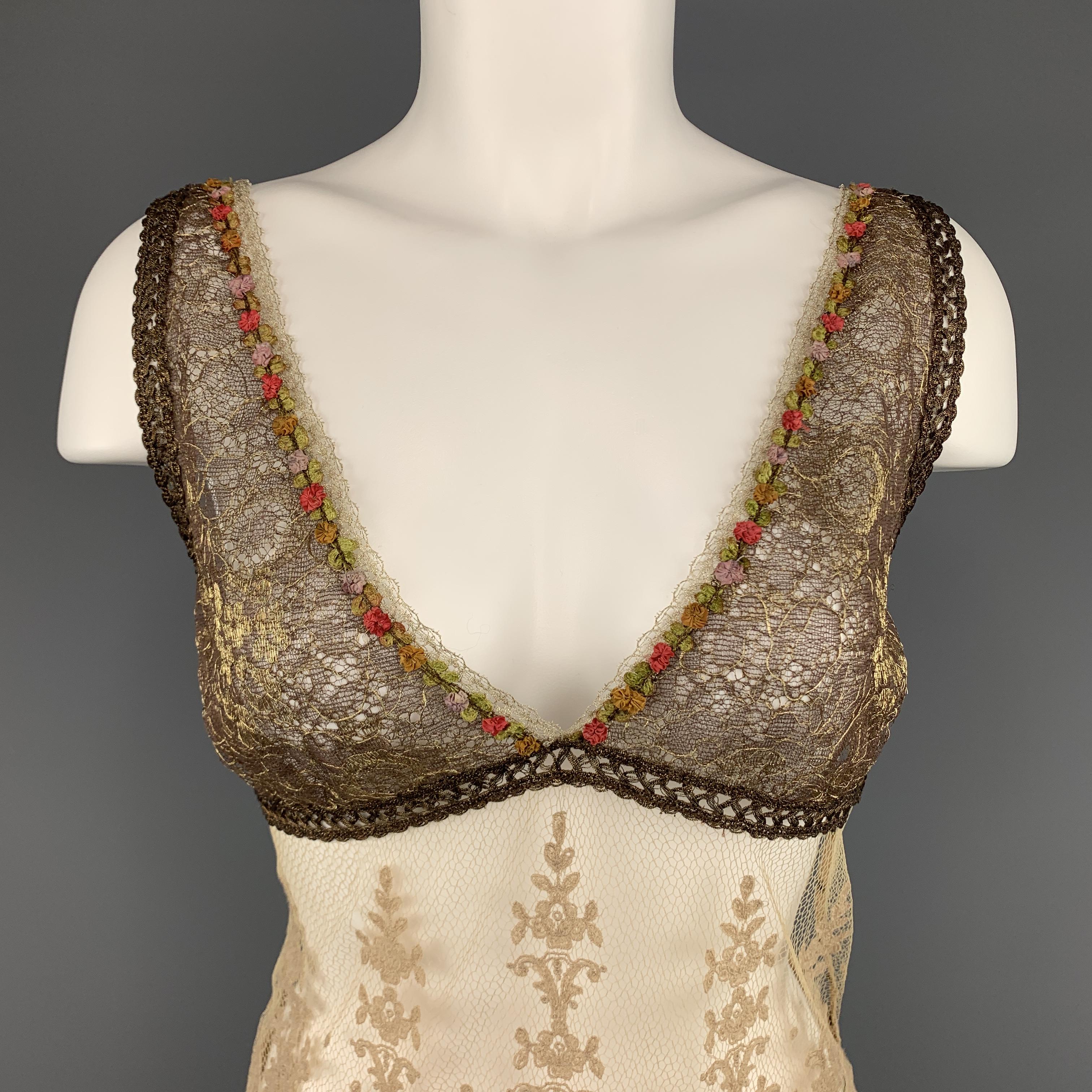 RALPH LAUREN blue label camisole top features a metallic gold bronze lace top with multi color floral applique trim, deep V neck line, and beige lace body.
 
Excellent Pre-Owned Condition.
Marked: 6
 
Measurements:
 
Shoulder: 14 in.
Bust: 34