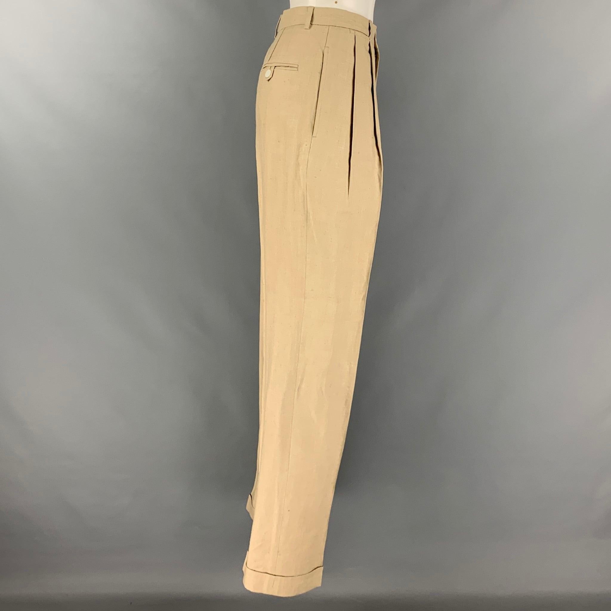 RALPH LAUREN BLUE LABEL dress pants comes in a beige and taupe linen woven material featuring a high waist, cuffed leg, pleated front, and a button fly closure. Made in Italy.Very Good Pre-Owned Condition. Moderate signs of wear. 

Marked:  6