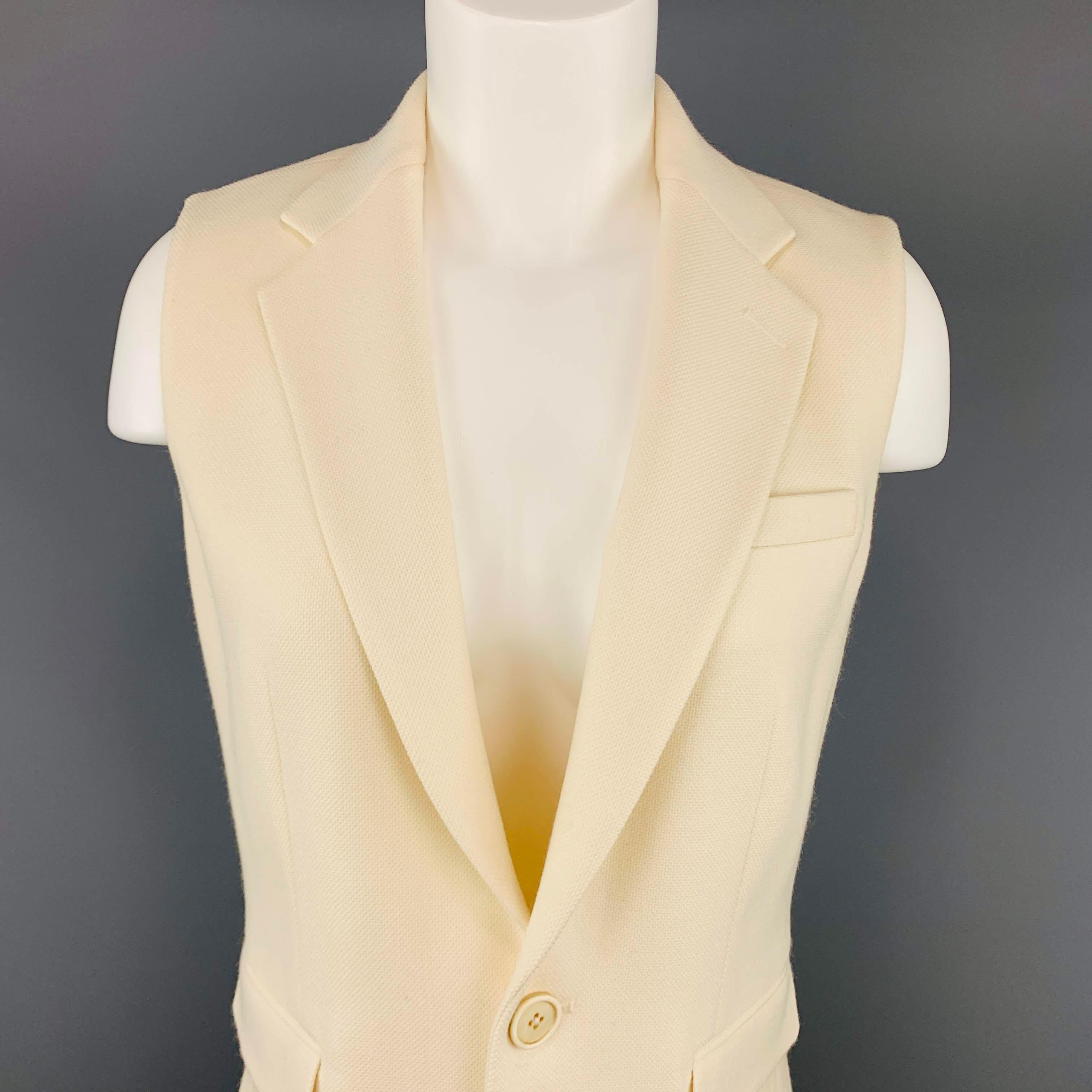 RALPH LAUREN COLLECTION sleeveless sport coat vest jacket comes in creamy beige textured wool with a notch lapel and single breasted two button closure. Made in USA.
Excellent Pre-Owned Condition.
 

Marked:   6
 

Measurements: 
  
lShoulder: 13.5