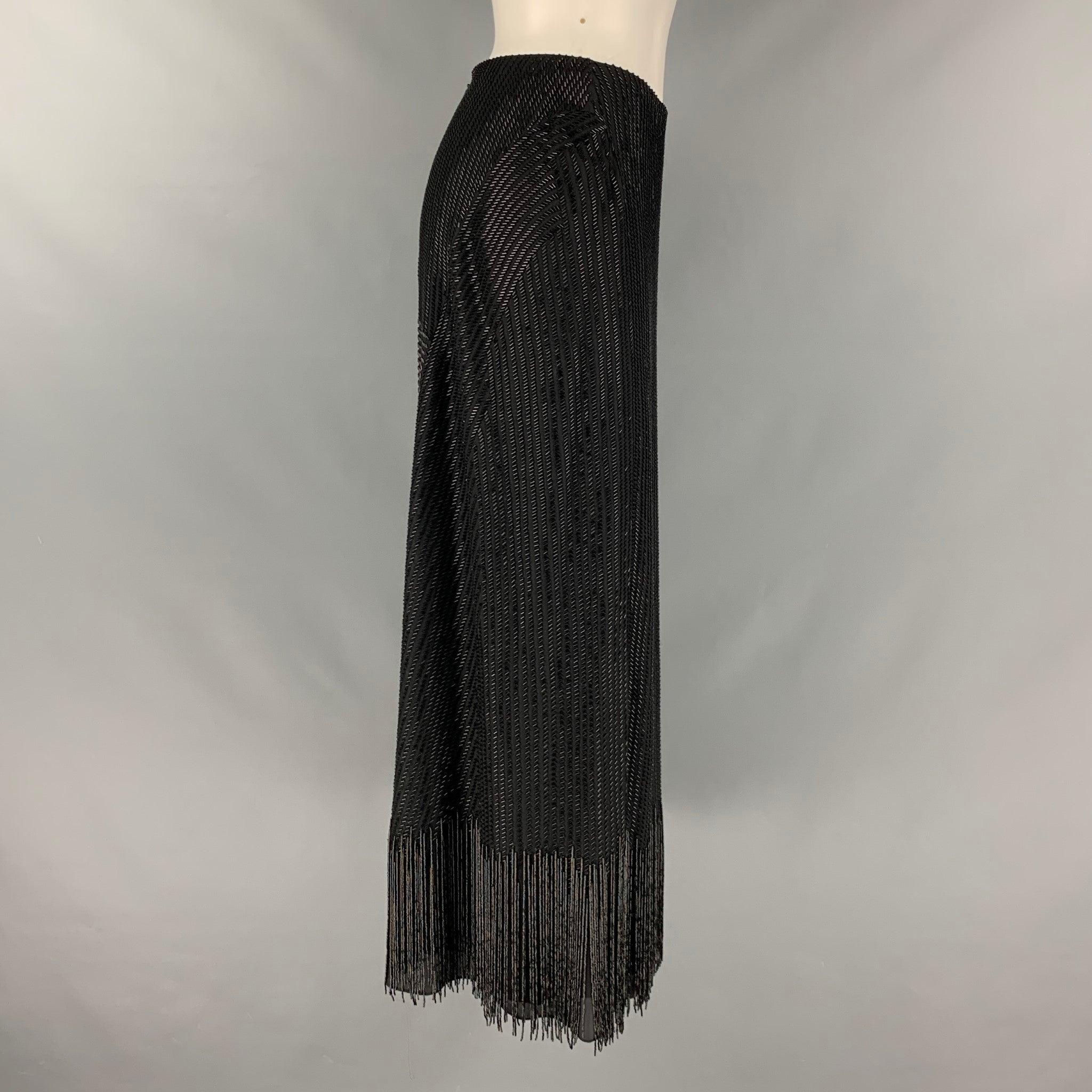 RALPH LAUREN COLLECTION dress skirt comes in a black beaded silk woven material featuring fringe details, and a center back zip up closure. Made in USA.Excellent Pre- Owned Condition. 

Marked:   6 

Measurements: 
  Waist: 29 inHip: 38 inches