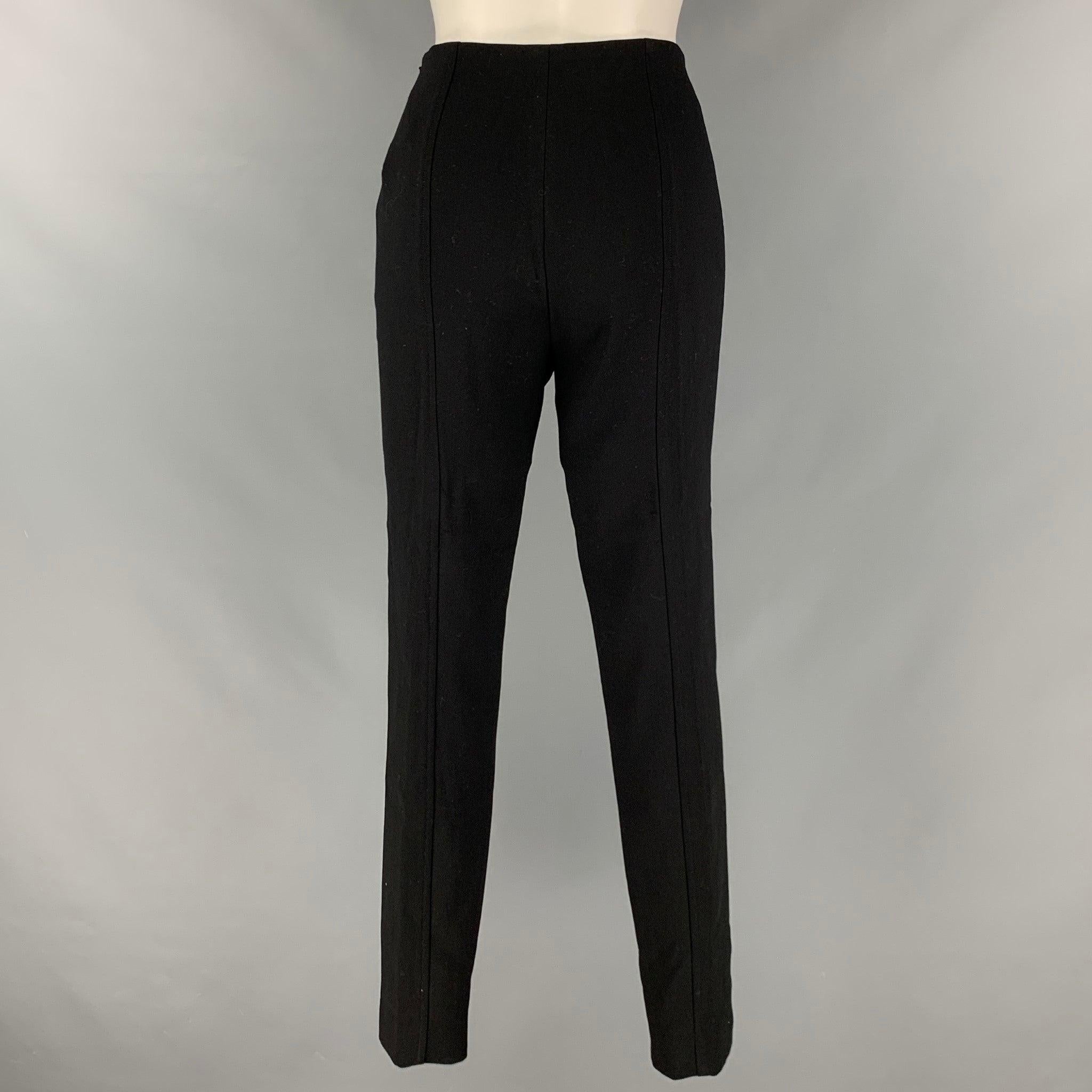 RALPH LAUREN COLLECTION dress pants comes in a black wool knit material featuring a fitted style, zipper cuffs, and a sized zip up closure. Made in USA.Excellent Pre- Owned Condition. 

Marked:  6 

Measurements: 
 Waist: 28 inches Rise: 10.5 inches