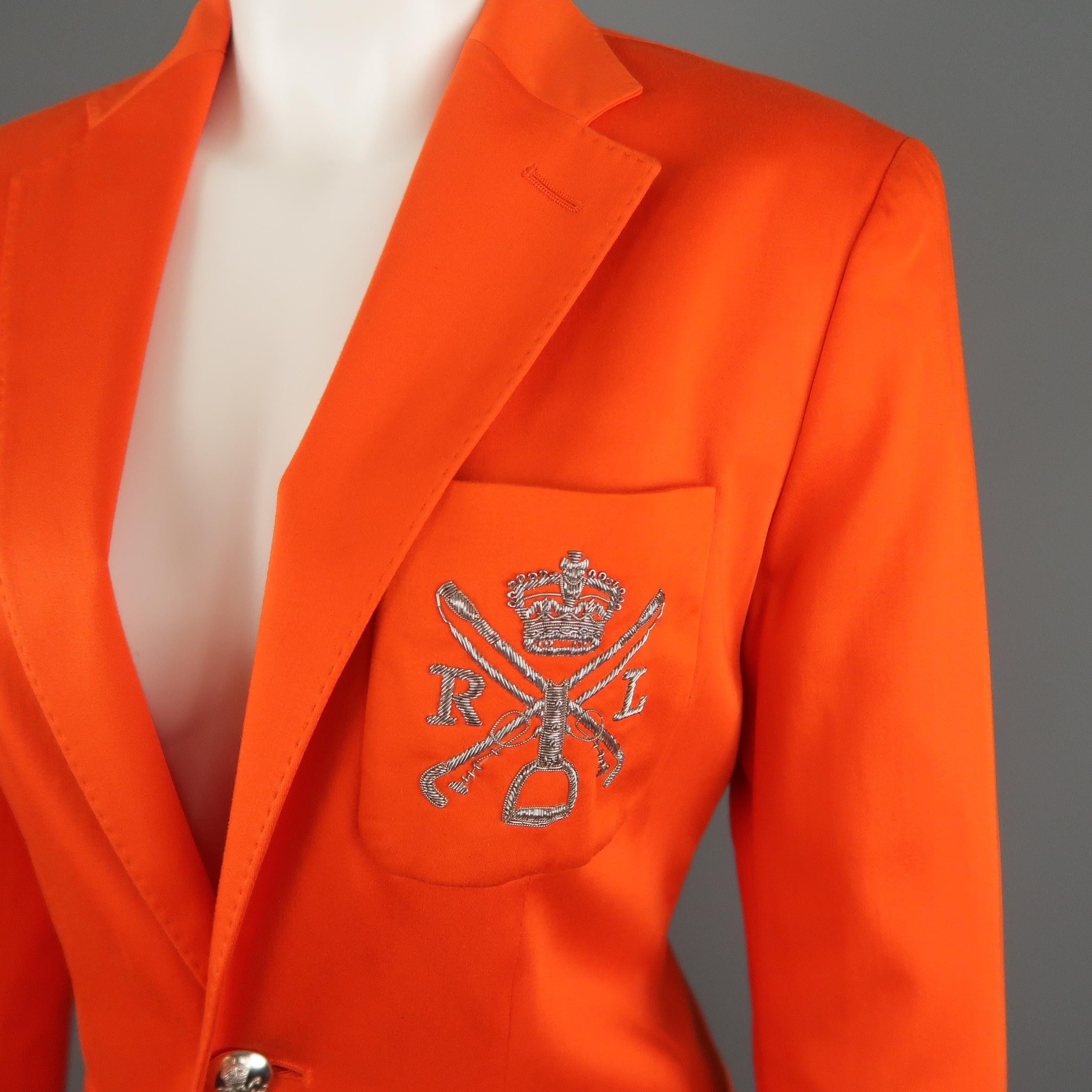 BLUE LABEL by RALPH LAUREN blazer jacket comes in bold orange cotton with a notch lapel, top stitching, patch flap pockets, silver tone metal crown buttons, and breast pocket with silver tone metal crest embroidery.
 
Excellent Pre-Owned