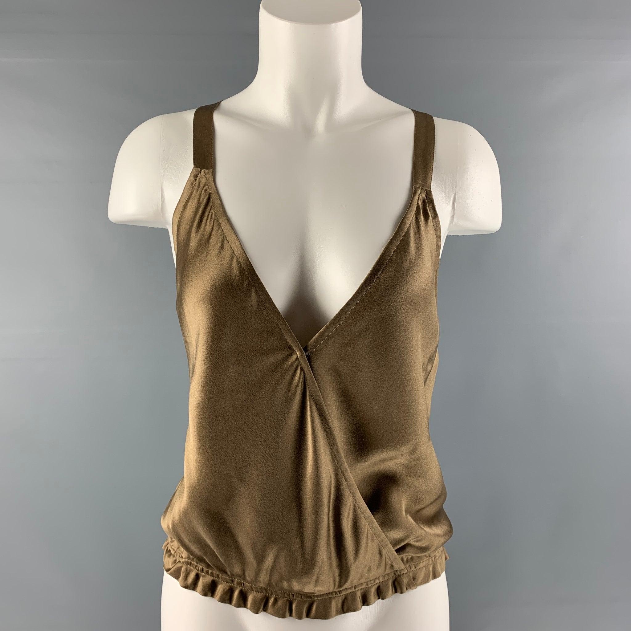 RALPH LAUREN 'BLUE LABEL by' racerback sleeveless blouse comes in a taupe silk featuring a metal hardware at back and elastic bottom hem. Excellent Pre-Owned Condition.  

Marked:   6 

Measurements: 
 
Shoulder: 9 inches Bust: 35 inches Length: 16