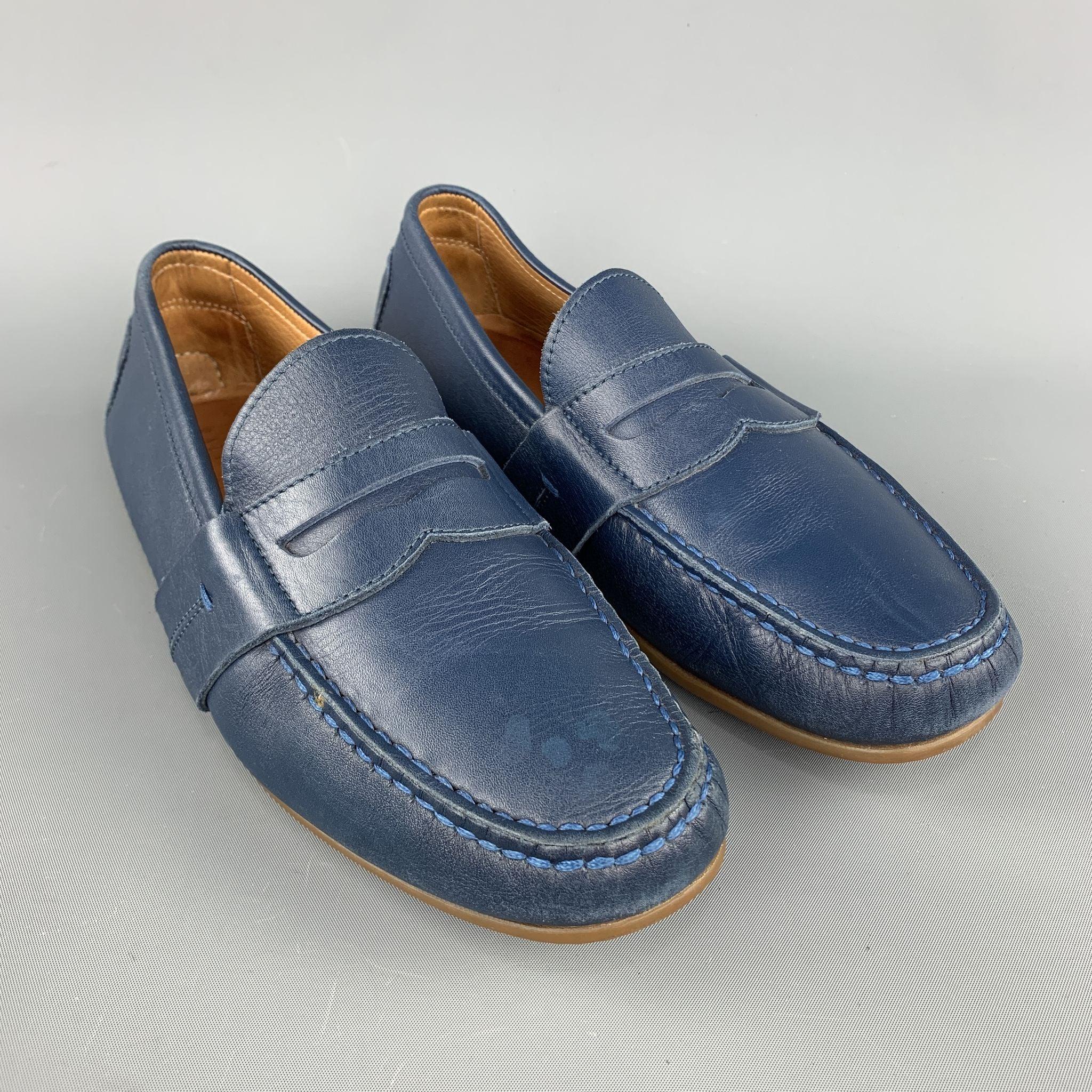 RALPH LAUREN loafers comes in a navy leather featuring a driver style, penny strap, and a rubber sole. Made in Italy.
Excellent Pre-Owned Condition.
 

Marked:   7.5 inches  
 

Measurements: 
  
l	Outsole: 10.5 in x 3 inches  

  
  
  
