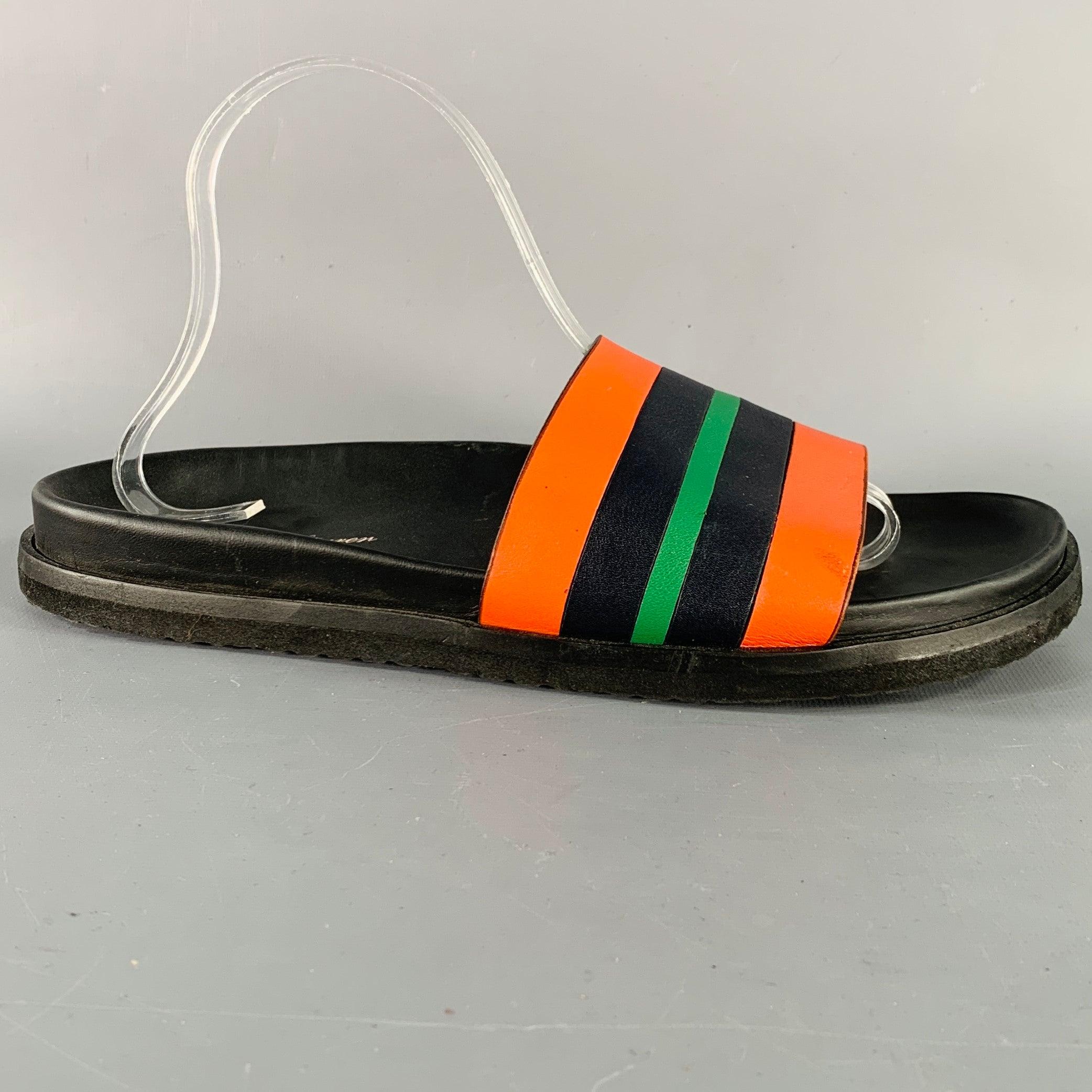 RALPH LAUREN sandals
in a black leather featuring a slide style, orange and green stripe design, and slip on closure. Made in Italy.Very Good Pre-Owned Condition. Minor marks and signs of wear. 

Marked:   815744318001 8 DOutsole: 11 x 4.25 inches 
