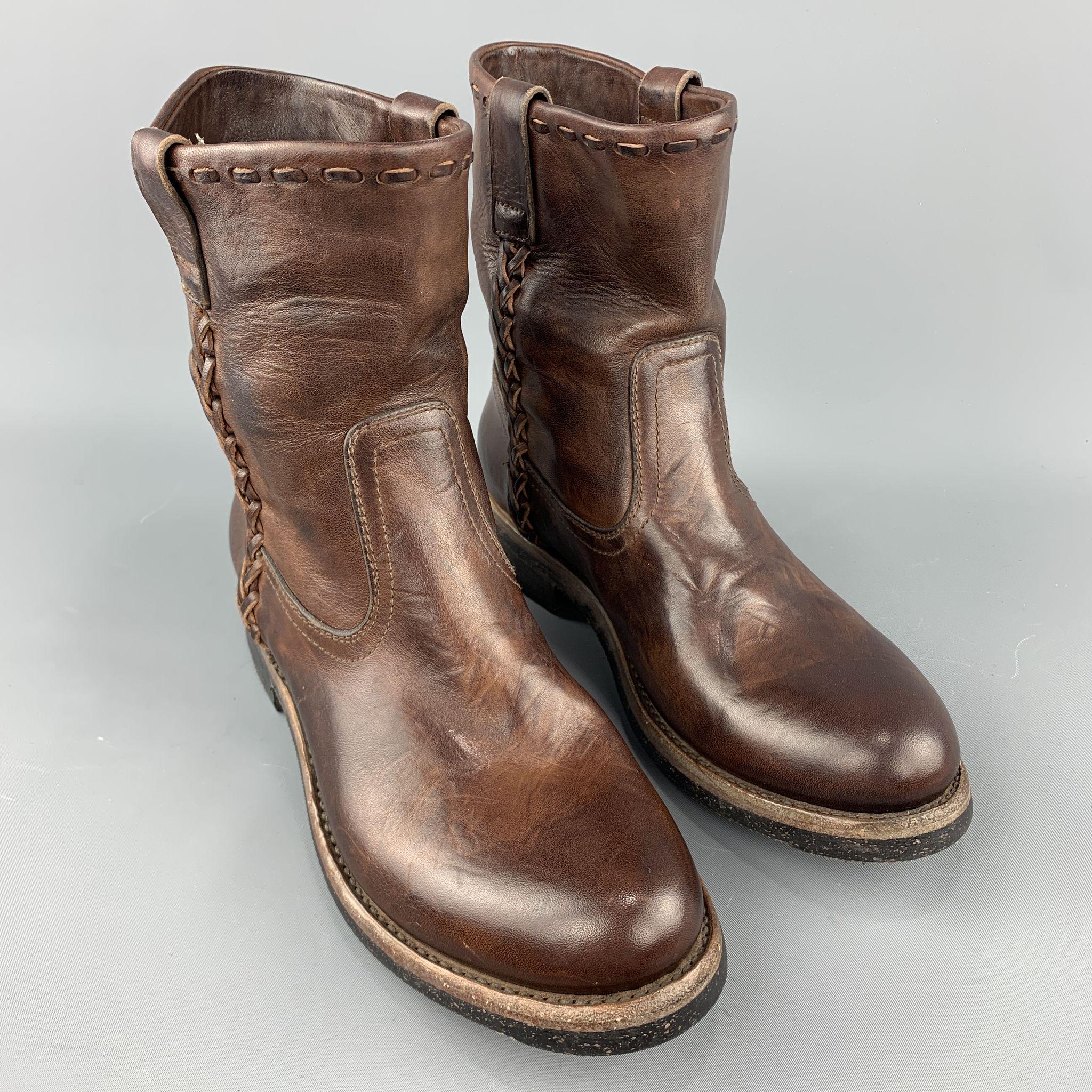 RALPH LAUREN boots comes in a brown antique leather featuring a ankle style, side braid details, and a rubber sole. Made in Italy.
 
Comes With Box.
Marked: 8
 
Measurements:
 
Width: 4 in.
Height: 8 in.
Length: 11 in.