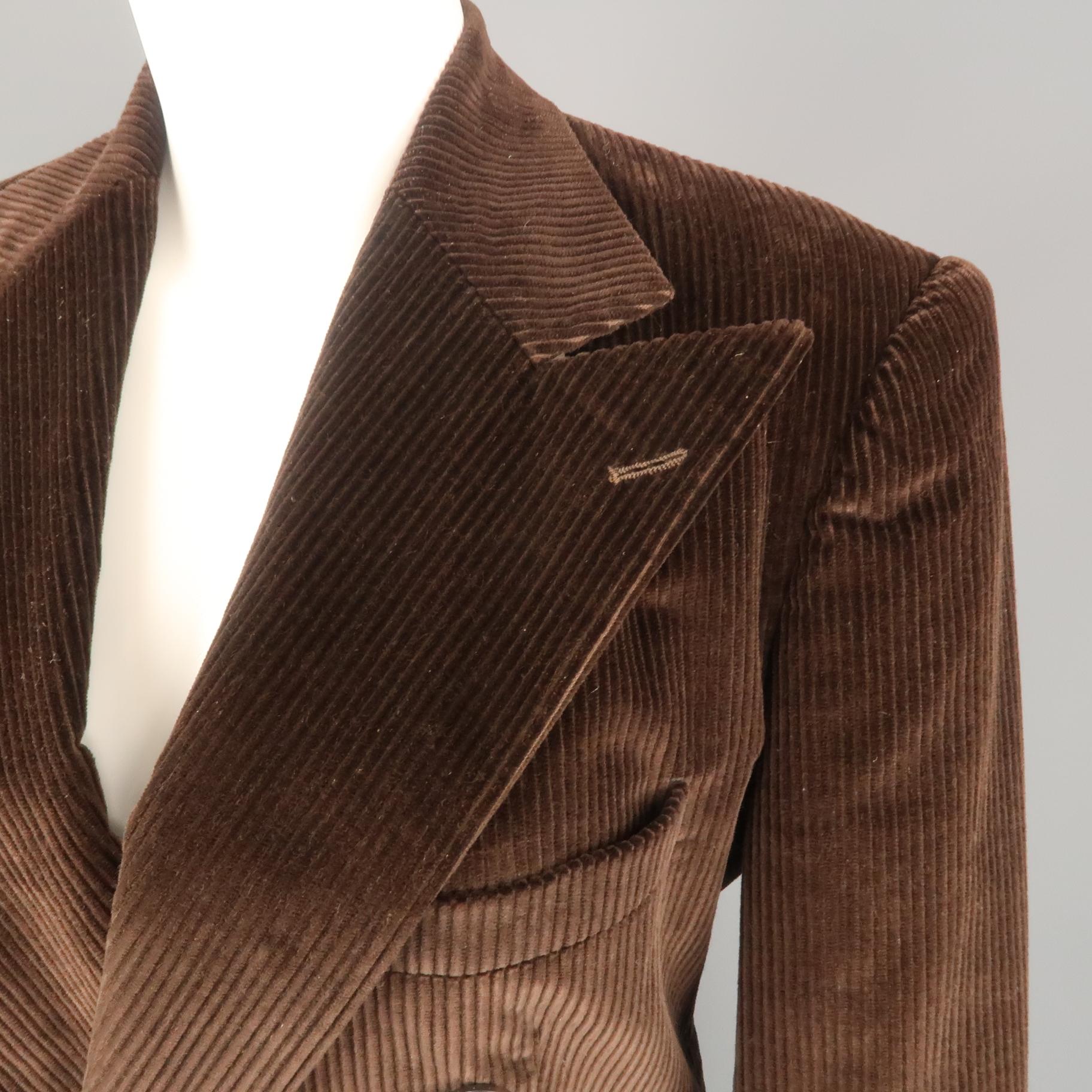 Vintage RALPH LAUREN COLLECTION sport jacket comes in brown corduroy with a peak lapel, double breasted button front, flap pockets, and cuffed sleeves.
 
Excellent Pre-Owned Condition.
Marked: 8
 
Measurements:
 
Shoulder: 17 in.
Bust: 40