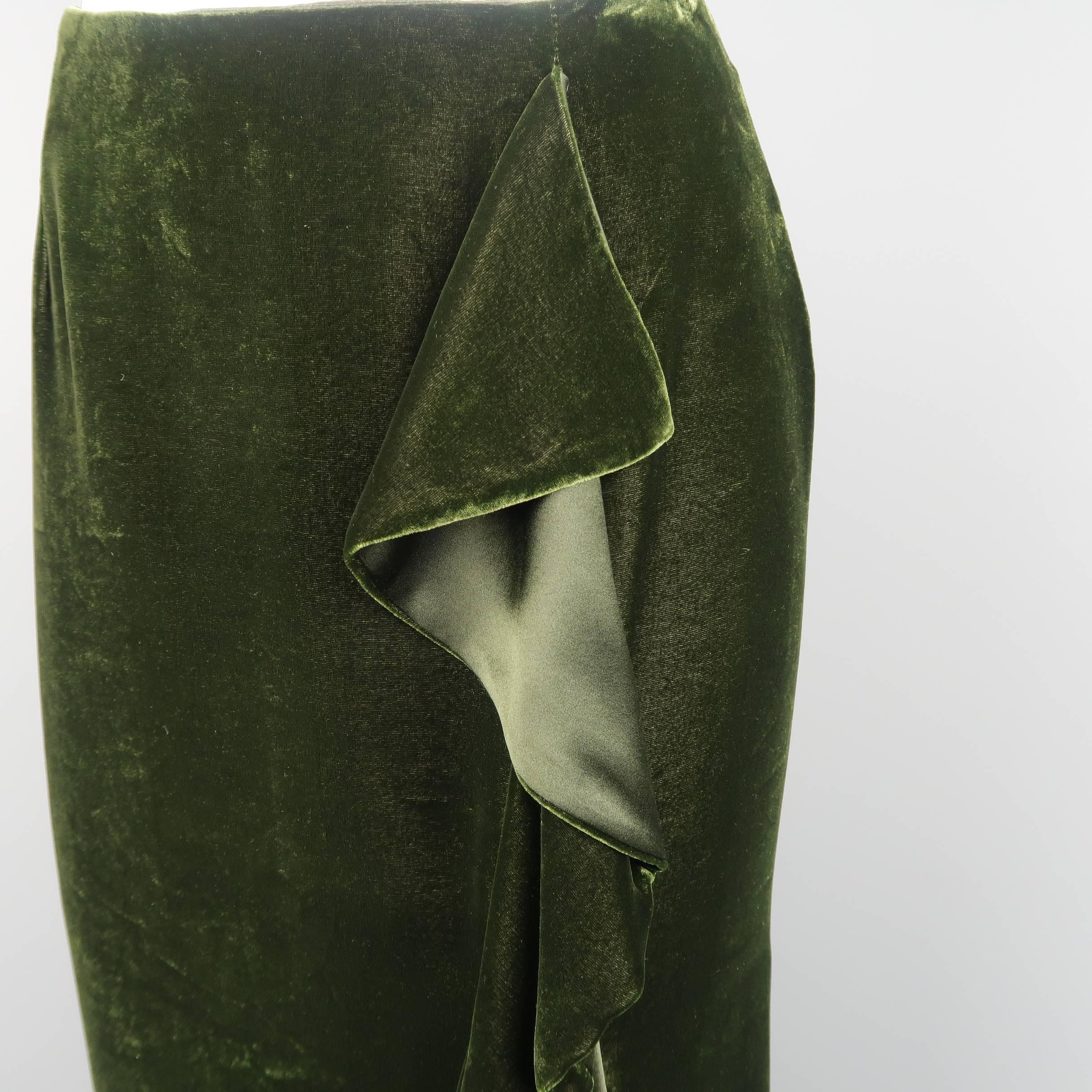RALPH LAUREN BLACK LABEL A line skirt comes in a deep green silk blend velvet with a cascading ruffle side slit. Minor wear.
 
Good Pre-Owned Condition.
Marked: 8
 
Measurements:
 
Waist: 31 in.
Hip: 39 in.
Length: 25 in.
