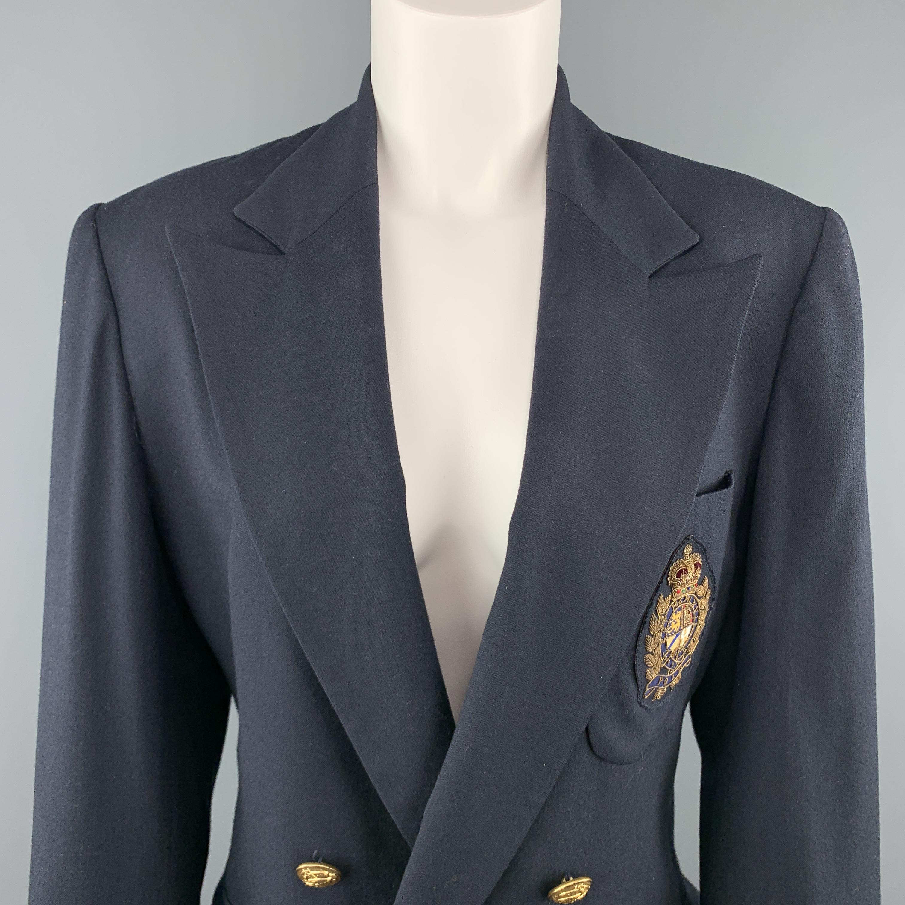 Vintage RALPH LAUREN blazer comes in navy blue wool with a double breasted gold tone button front, peak lapel, patch flap pockets, and embroidered crest patch. Made in Italy.

Very Good Pre-Owned Condition.
Marked: 8

Measurements:

Shoulder: 17