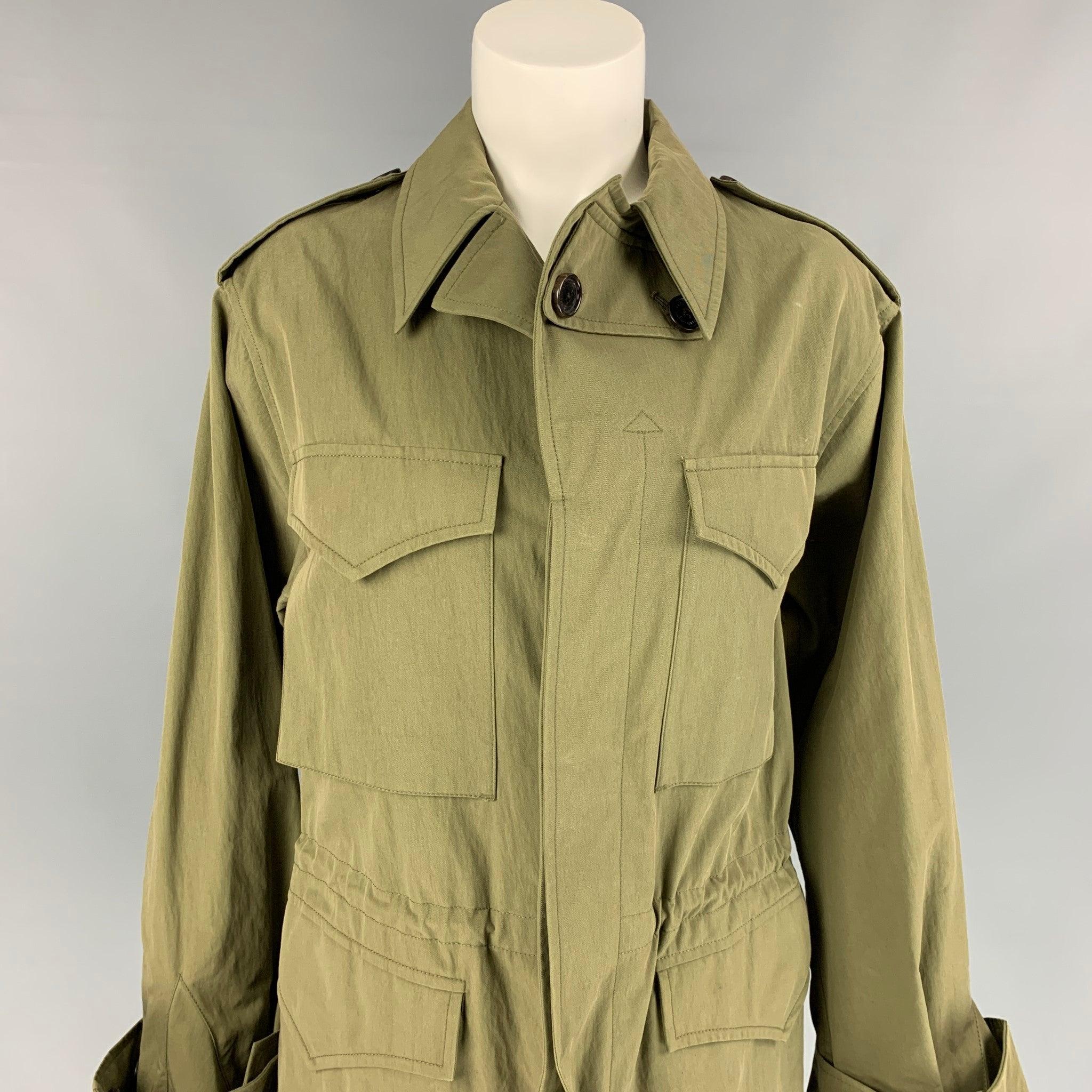 RALPH LAUREN Collection trench coat comes in a olive cotton / nylon featuring a safari style, drawstring details, epaulettes, flap pockets, and a hidden placket closure. Made in Italy.
Excellent
Pre-Owned Condition. 

Marked:  8 

Measurements: 
