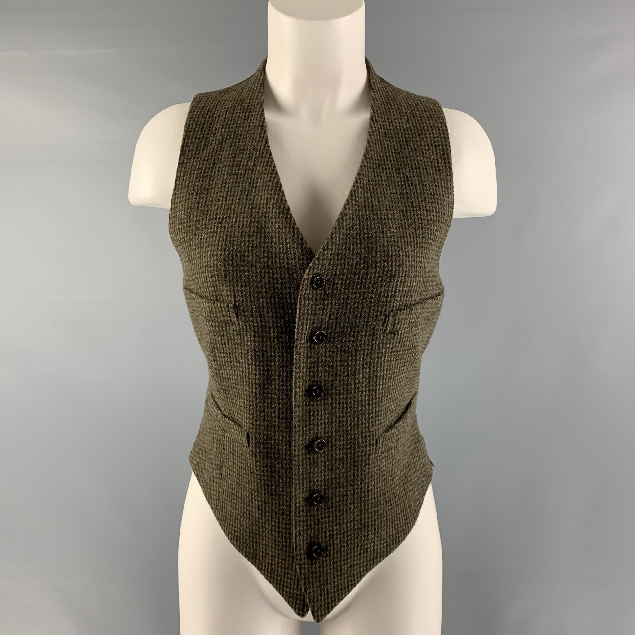 RALPH LAUREN COLLECTION Fall 2016 vest comes in an olive and taupe wool and silk featuring four faux pockets, back belt, and a buttoned closure. Made in USA.

Excellent Pre-Owned Condition.
Marked: 8

Measurements:

Shoulder: 11 in.
Chest: 36