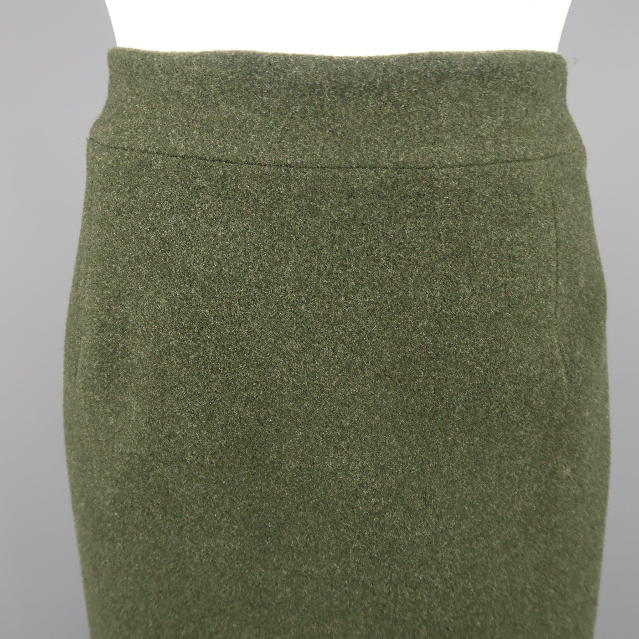 Vintage COLLECTION by RALPH LAUREN skirt comes in forest green wool cashmere blend felt with an A line shape and darted waist. Matching jacket sold separately. Made in USA.
Excellent Pre-Owned Condition.
 

Marked:   8
 

Measurements: 
  
l	Waist: