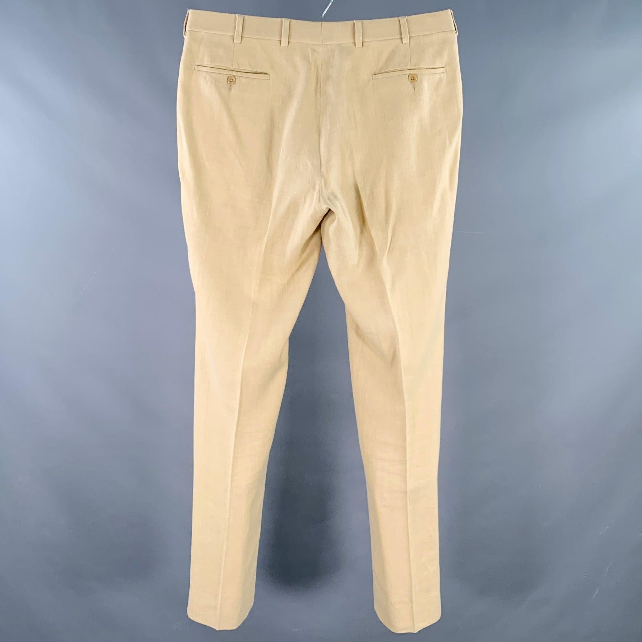 RALPH LAUREN PURPLE LABEL dress pants
in an eco-friendly beige woven hemp featuring a flat front style, tapered leg, and zip fly closure. Made in Italy. Note: this garment has been professionally altered. Please double check measurements.Very Good