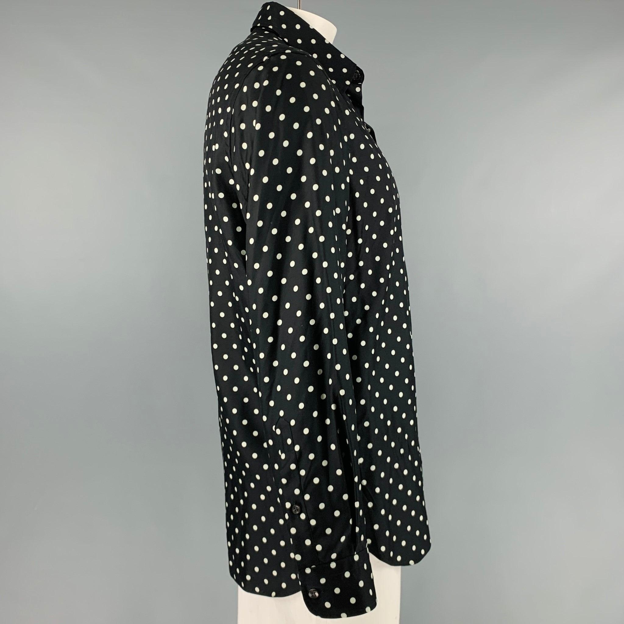 RALPH LAUREN PURPLE LABEL long sleeve shirt
in a black silk fabric featuring white polka dot pattern, spread collar, and button closure. Made in Italy.Very Good Pre-Owned Condition. Minor mark. 

Marked:   L 

Measurements: 
 
Shoulder: 19 inches