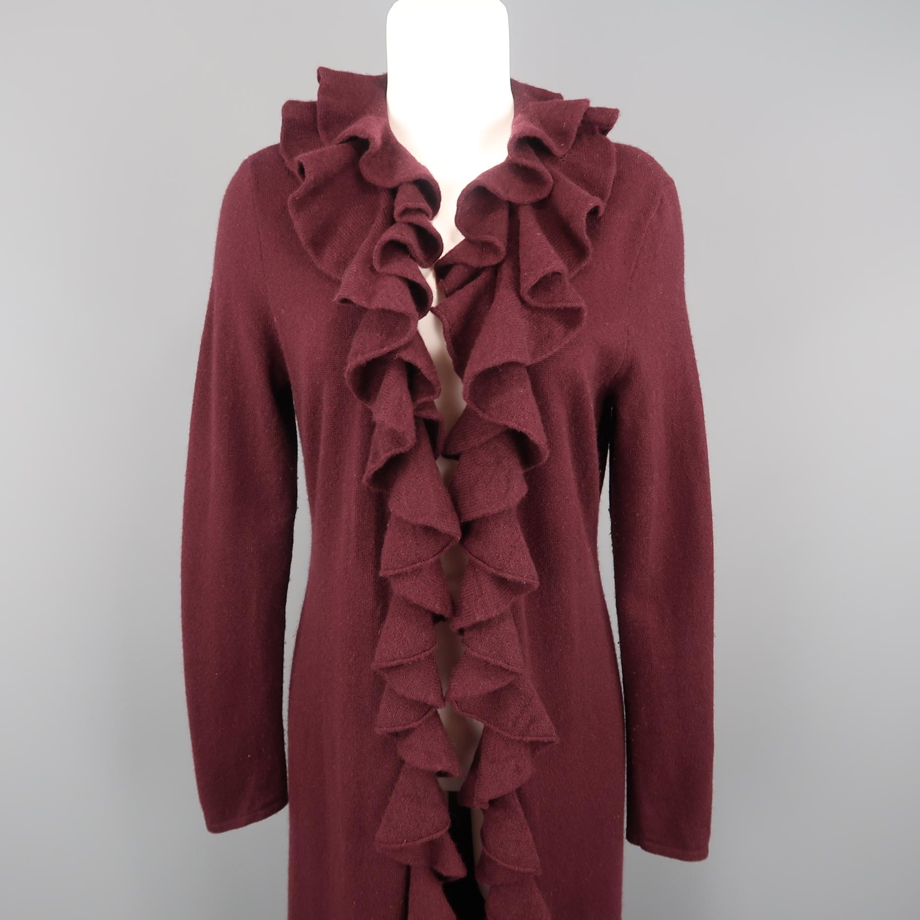 RALPH LAUREN BLACK LABEL cardigan coat comes in burgundy cashmere knit with an open front and ruffled collar and trim.
 
Very Good Pre-Owned Condition. Retails: $698.00.
Marked: L
 
Measurements:
 
Shoulder: 15 in.
Bust: 38 in.
Waist: 36 in.
Hip: 38