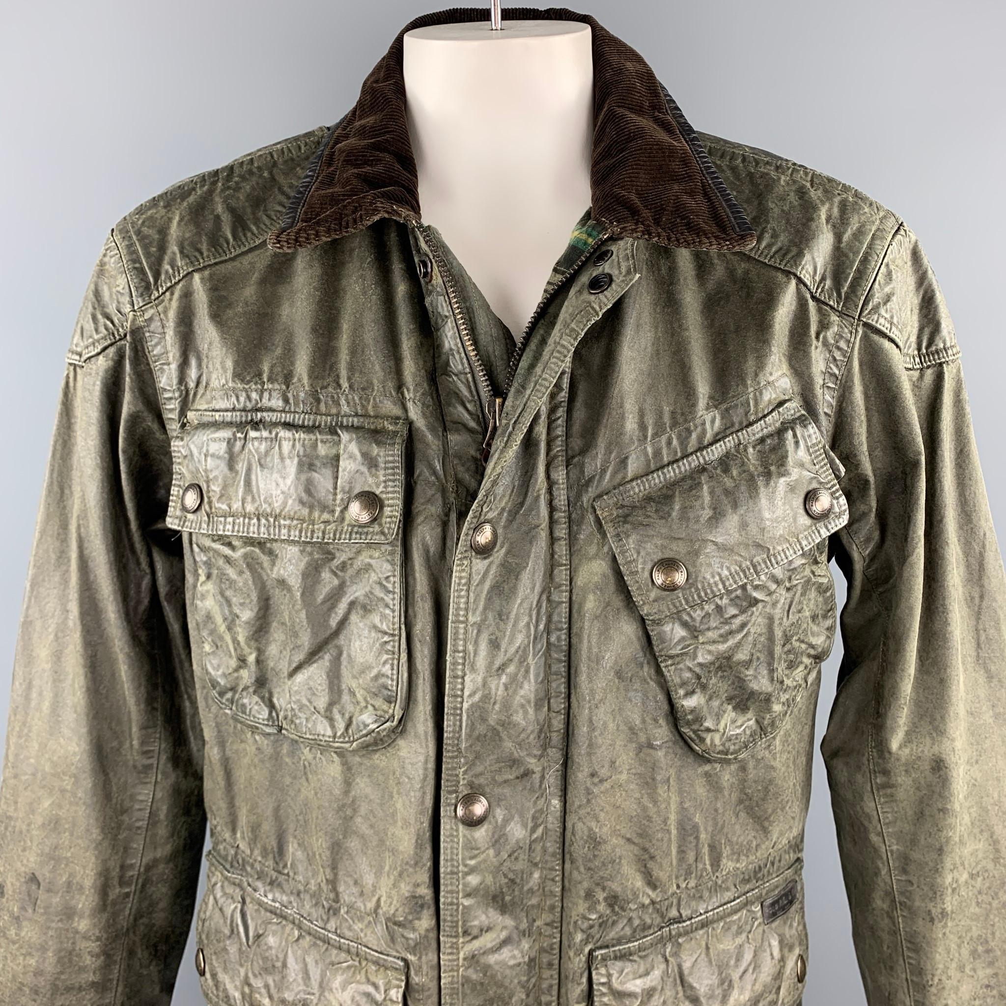 RALPH LAUREN jacket comes in a moss green coated cotton with a half plaid liner featuring snap button flap pockets, corduroy collar, strap details, and a zip and snap button closure. 

Good Pre-Owned Condition.
Marked:

Measurements:

Shoulder: 21