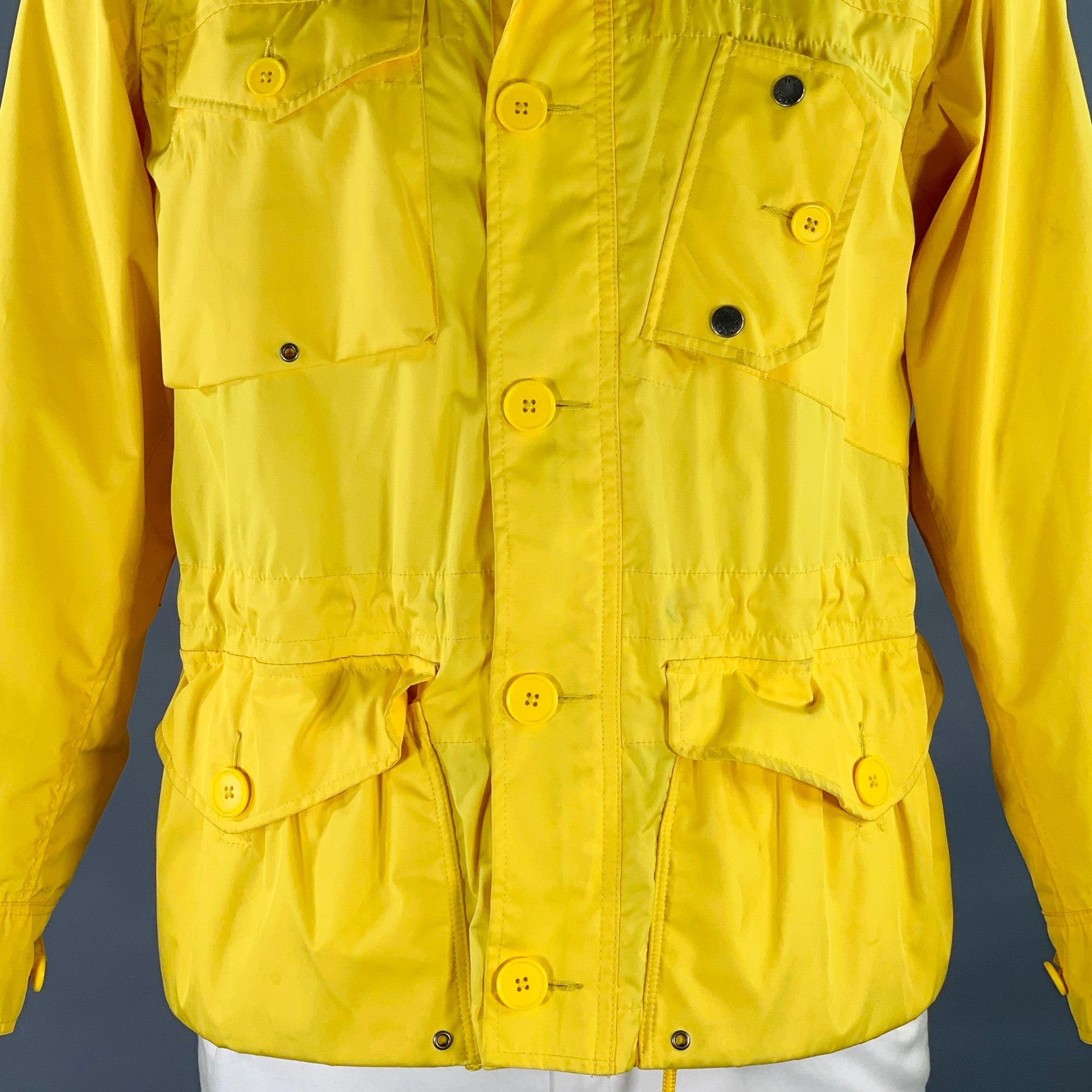 POLO by RALPH LAUREN jacket
in a yellow polyester fabric feauring a hooded style, multiple utilitarian pockets, and zip & buttons closure.Good Pre-Owned Condition. Moderate marks, as is. 

Marked:   L 

Measurements: 
 
Shoulder: 19.5 inches Chest: