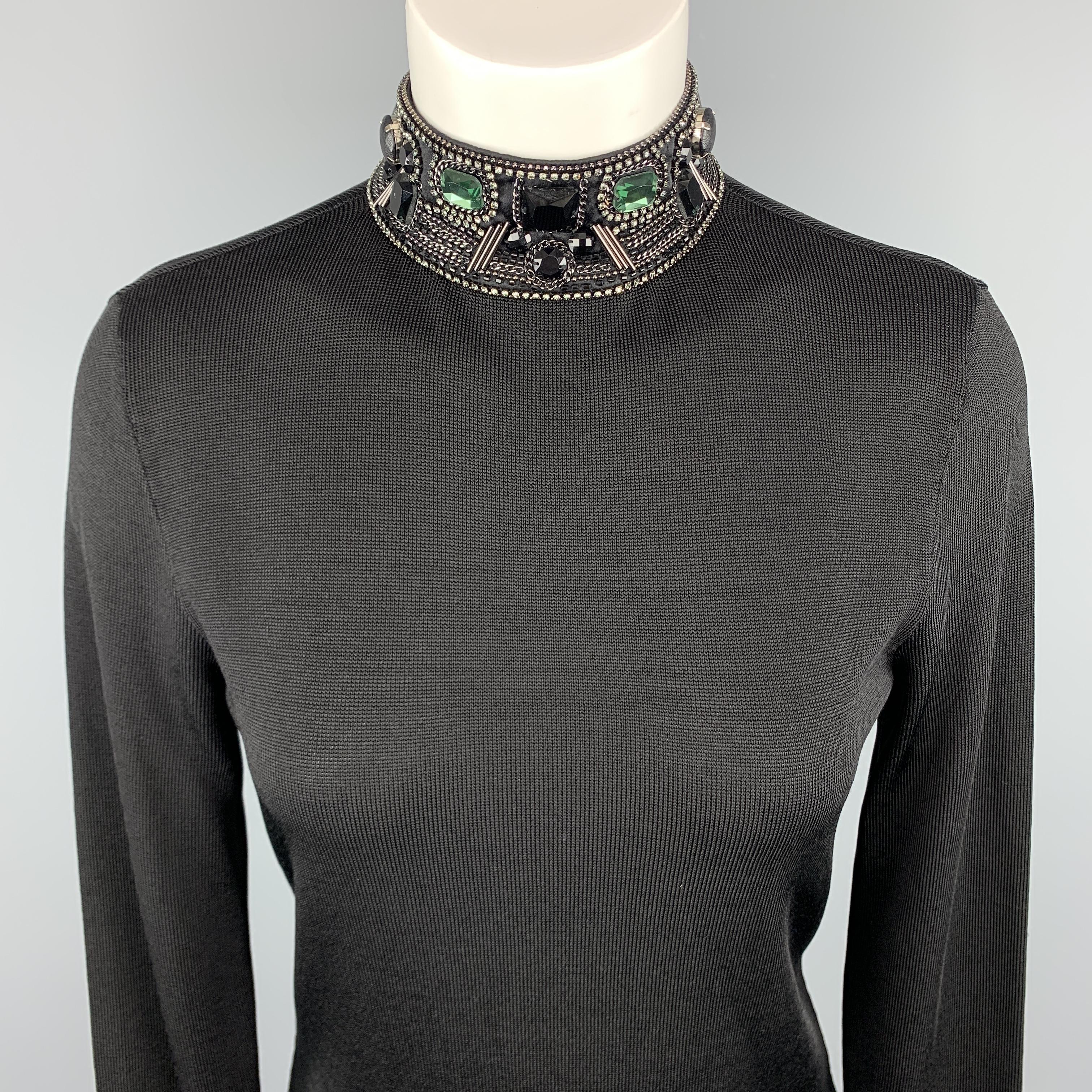 BLACK LABEL by RALPH LAUREN Dress Top comes in a black tone in a solid viscose /silk material, with a mock turtleneck, rhinestone, a open back detail and long sleeves.
 
Excellent Pre-Owned Condition.
Marked: M
 
Measurements:
 
Shoulder: 14.5