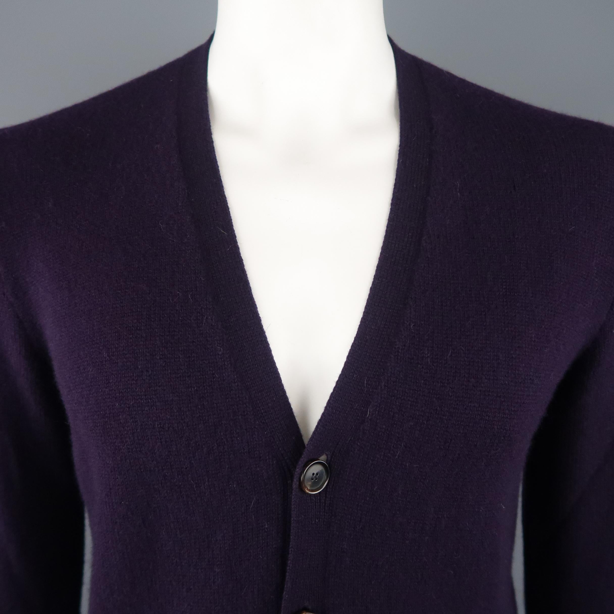 RALPH LAUREN PURPLE LABEL Cardigan Sweater comes in a eggplant tone in a knitted cashmere material, with 4 buttons at closure, slit pockets and ribbed cuffs and hem. Made in Italy.
 
Excellent Pre-Owned Condition.
Marked: M
 
Measurements:
