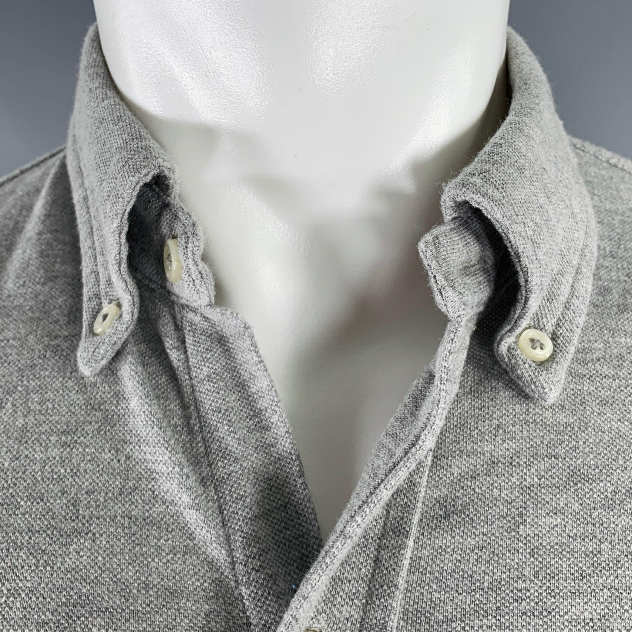 RALPH LAUREN long sleeve shirt
in a heather grey cotton knit featuring embroidered logo, button down collar, and button closure.Excellent Pre-Owned Condition. 

Marked:   M 

Measurements: 
 
Shoulder: 17.5 inches Chest: 42 inches Sleeve: 25.5