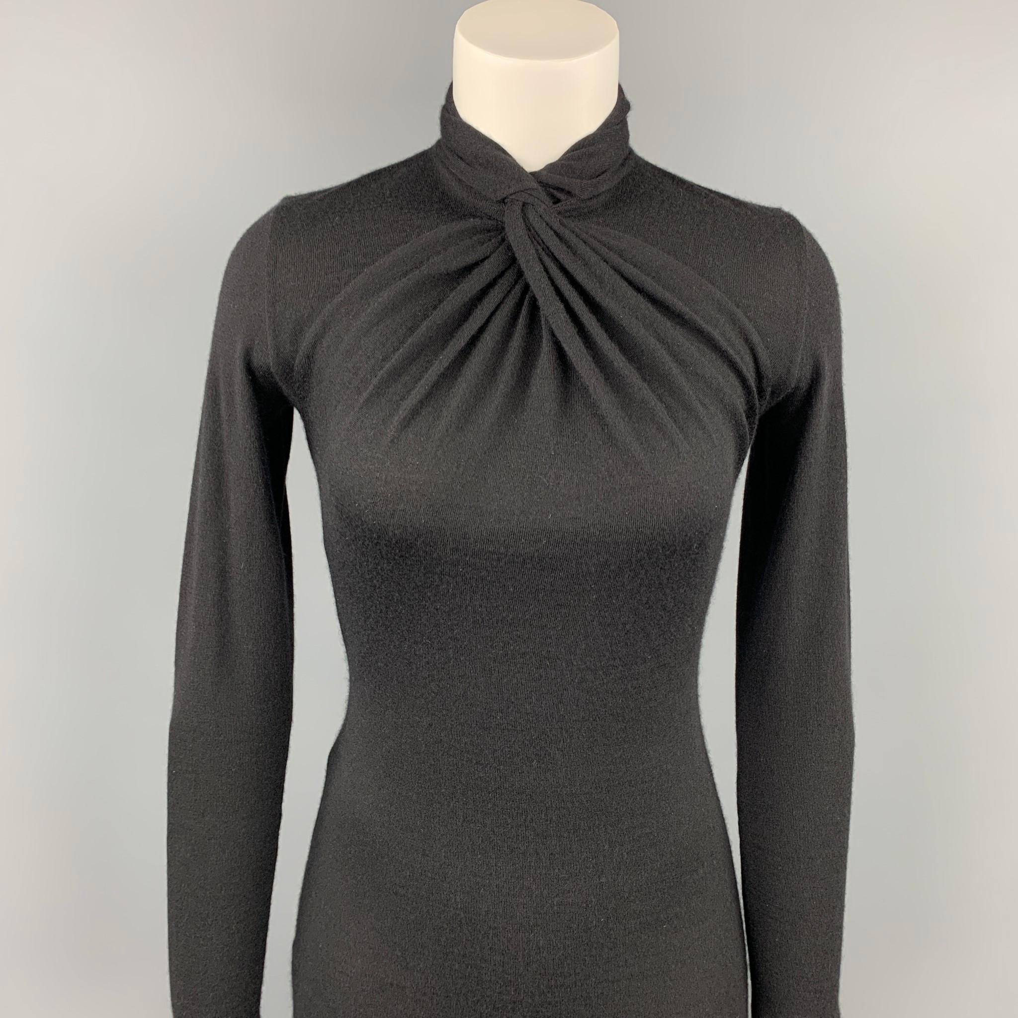 RALPH LAUREN dress comes in a black knitted cashmere featuring a high collar, long sleeves, and a back button closure.

Very Good Pre-Owned Condition.
Marked: No fabric tag

Measurements:

Shoulder: 14.5 in.
Bust: 31 in.
Waist: 26 in.
Hip: 32