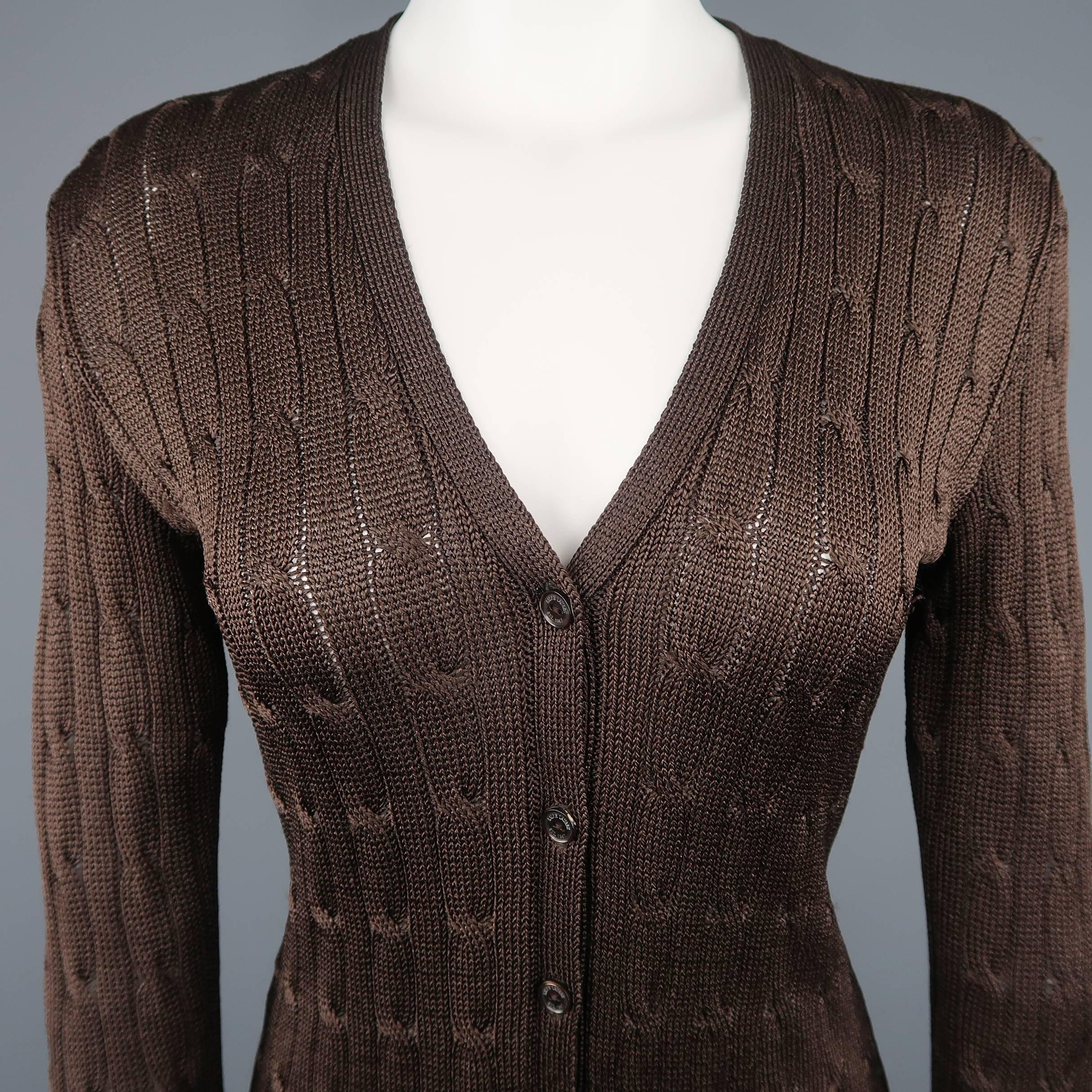 RALPH LAUREN BLACK LABEL cardigan comes in chocolate brown silk cable knit with a V neck, pockets, and extra long length.
 
Good Pre-Owned Condition.
Marked: S
 
Measurements:
 
Shoulder: 16 in.
Bust: 34 in.
Sleeve: 25 in.
Length: 31 in.
