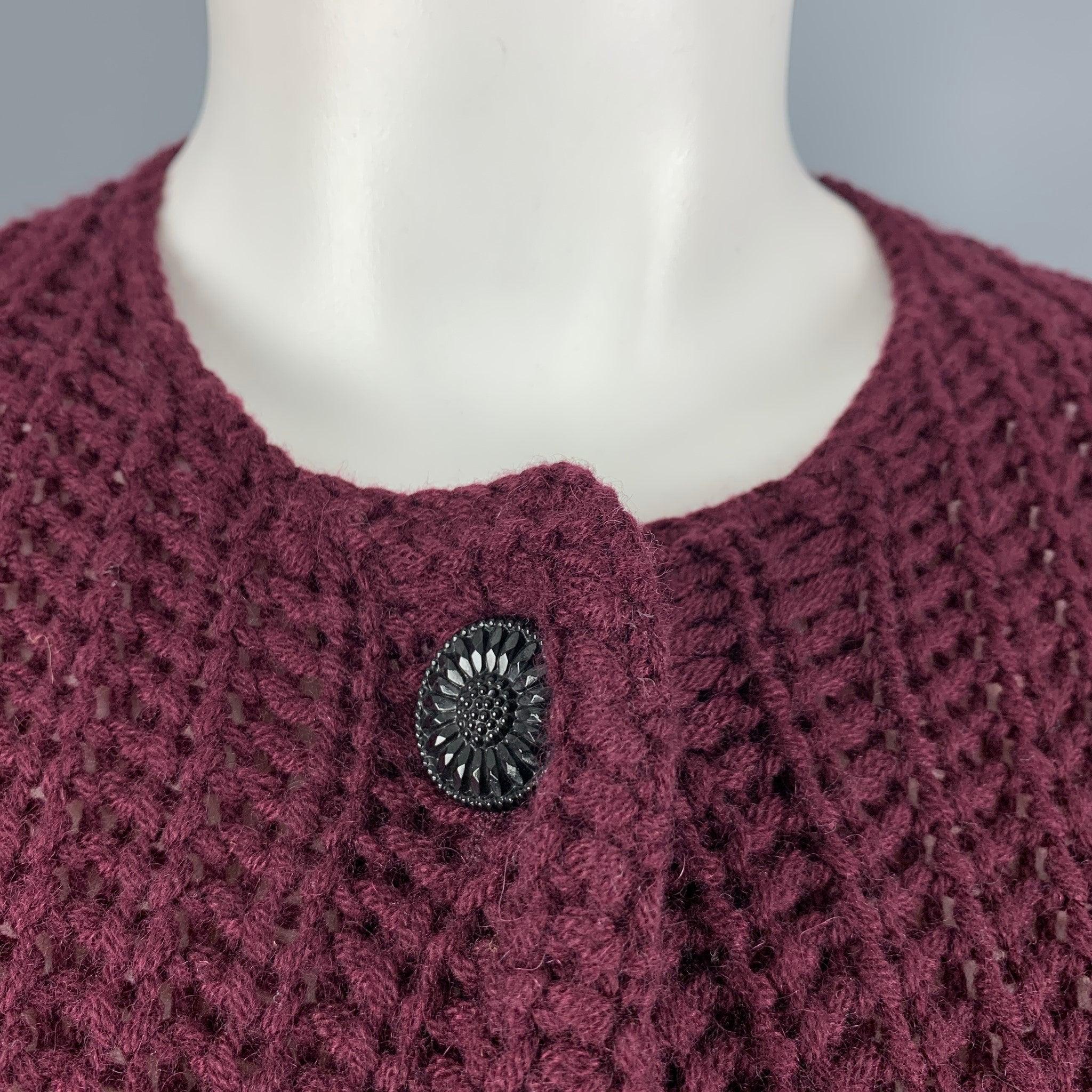RALPH LAUREN COLLECTION by cardigan sweater comes in a burgundy knitted cashmere featuring a buttoned closure. Made in Italy.Excellent Pre-Owned Condition. 

Marked:   M 

Measurements: 
 
Shoulder: 15.5 inches Chest: 35 inches Sleeve: 27 inches